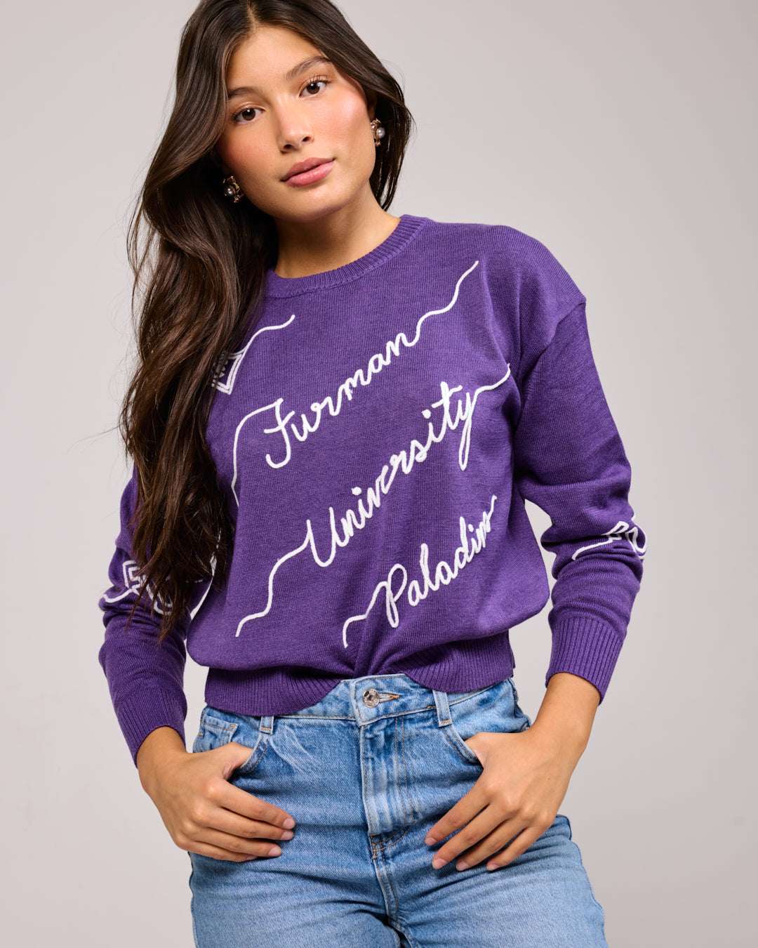 purple crewneck sweater with furman university paladins embroidery, styled for college game day