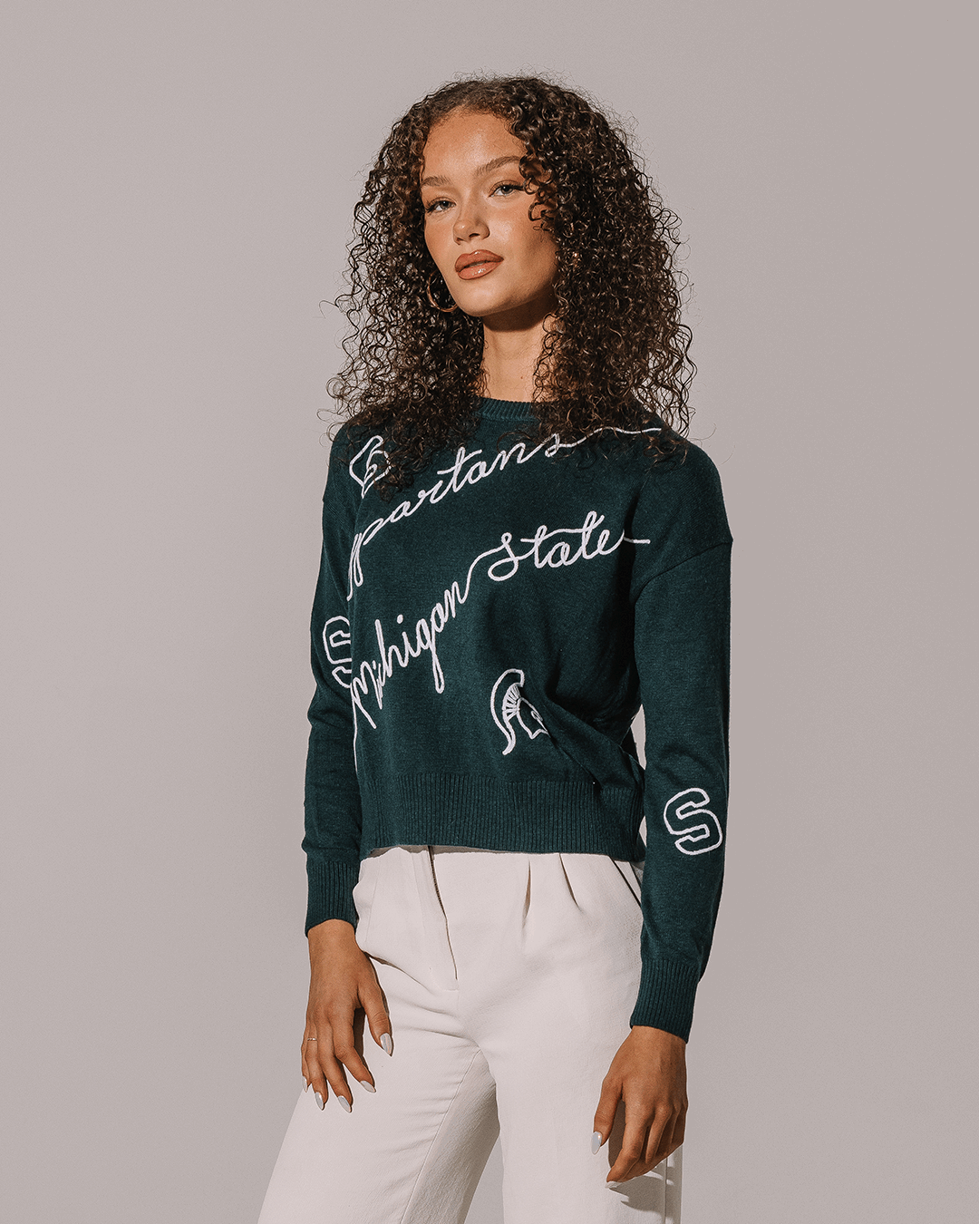 green long sleeve sweater with michigan state spartans embroidery, perfect for college game day looks