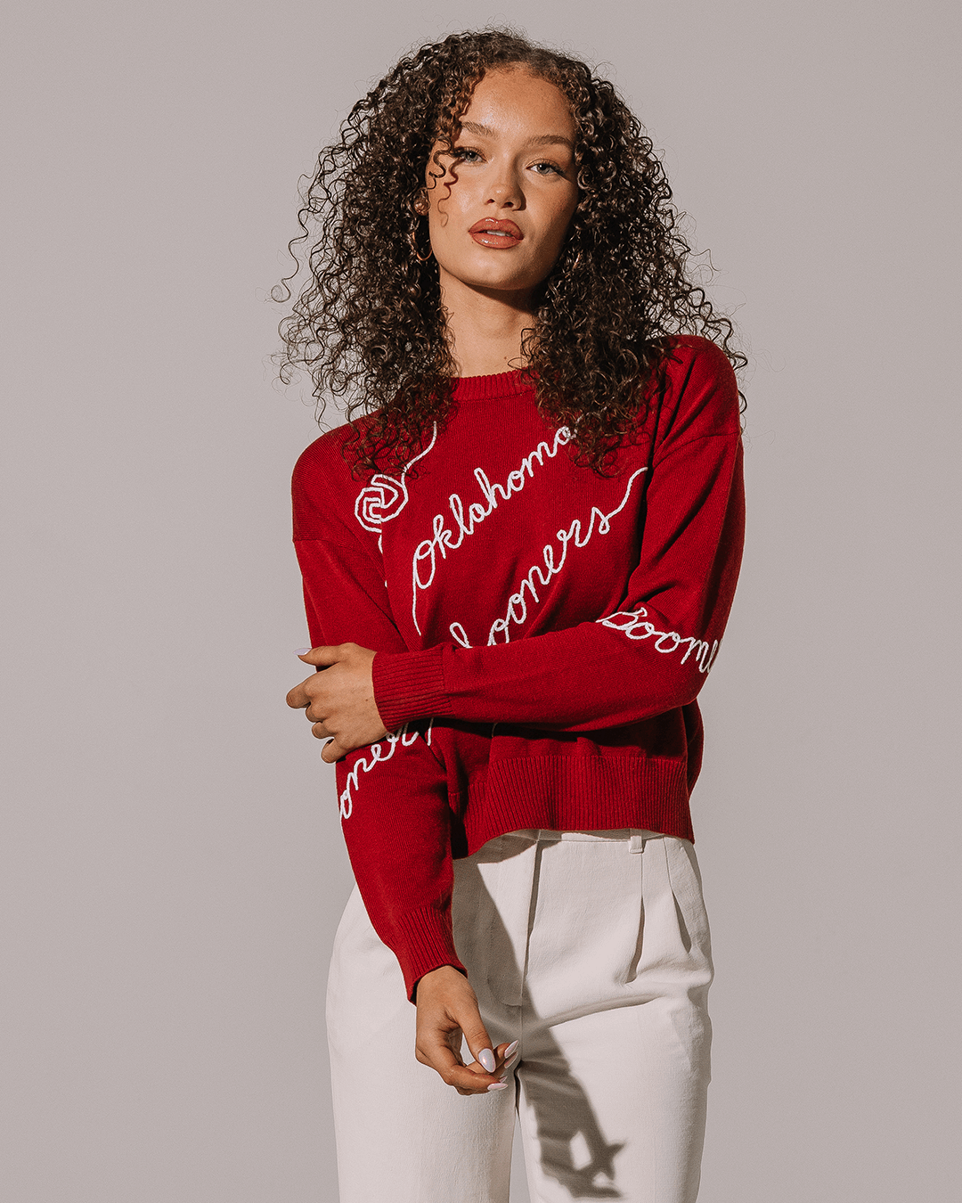 red crewneck sweater with oklahoma sooners embroidery, perfect for college campus.