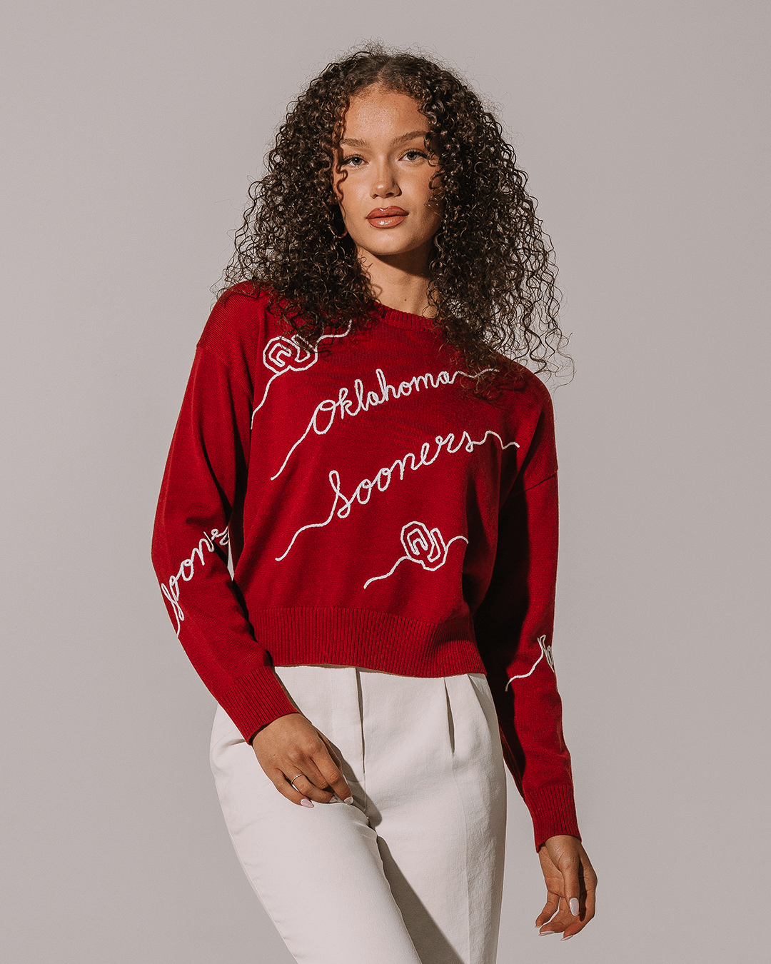 red crewneck sweater with oklahoma sooners embroidery, perfect for college campus.
