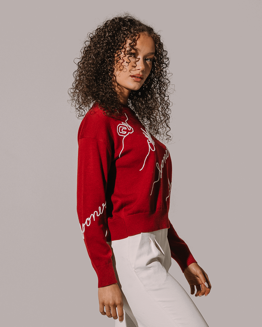 red crewneck sweater with oklahoma sooners embroidery, perfect for college campus.