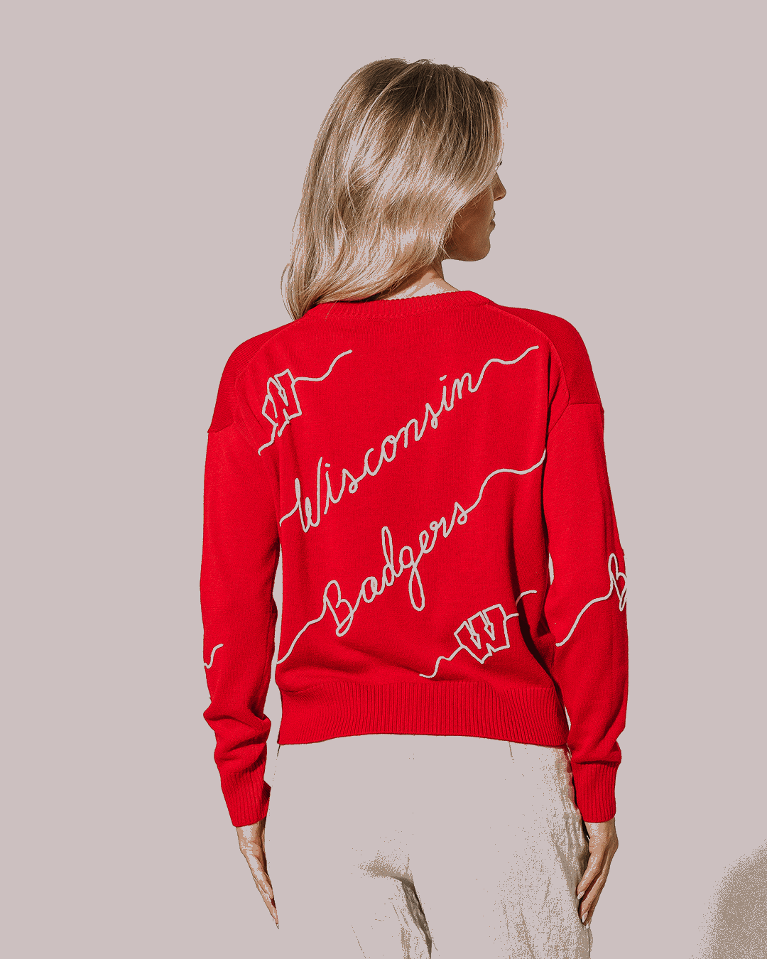 Red crewneck sweater with Wisconsin Badgers embroidery perfect for college outfits
