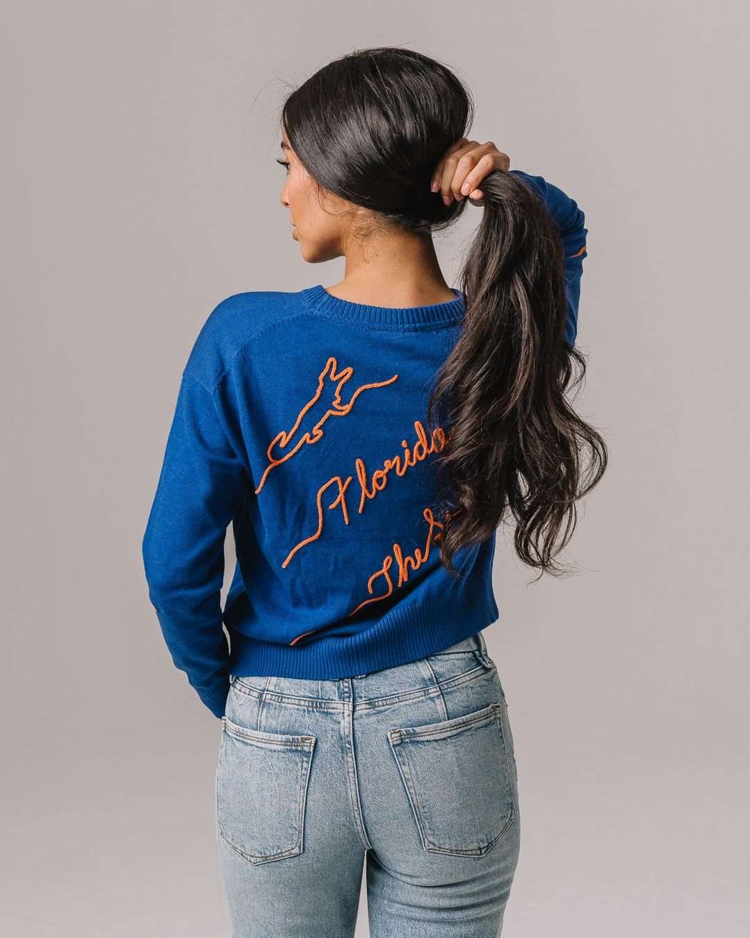 blue and orange NCAA crewneck sweater with Florida Gators embroidered logo, perfect for campus wear