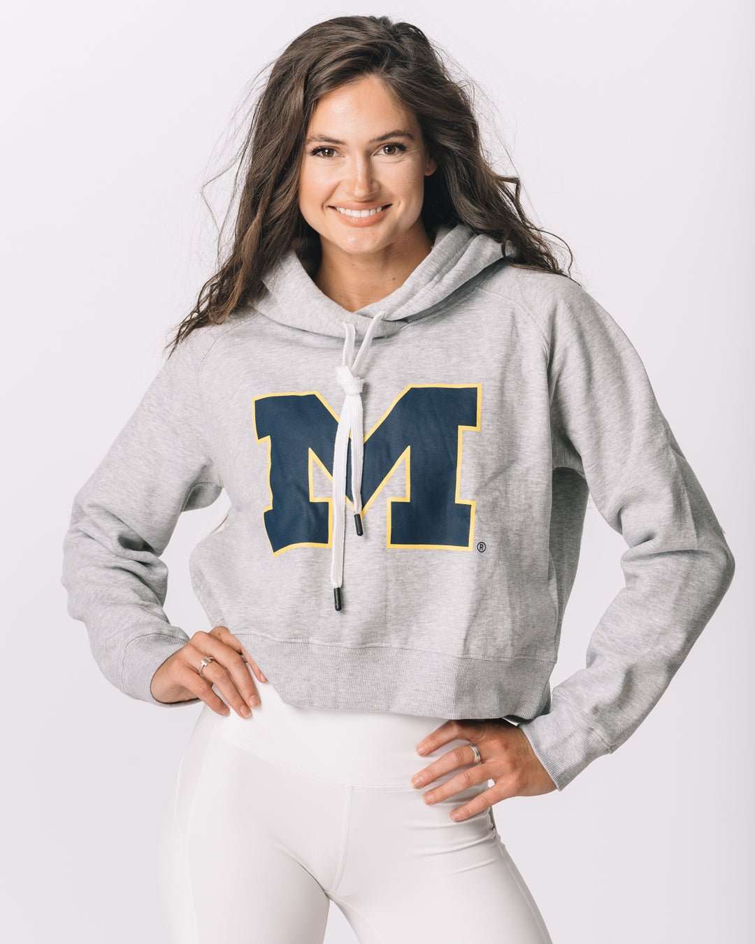 heather gray crop hoodie with michigan wolverines logo, styled for college game day