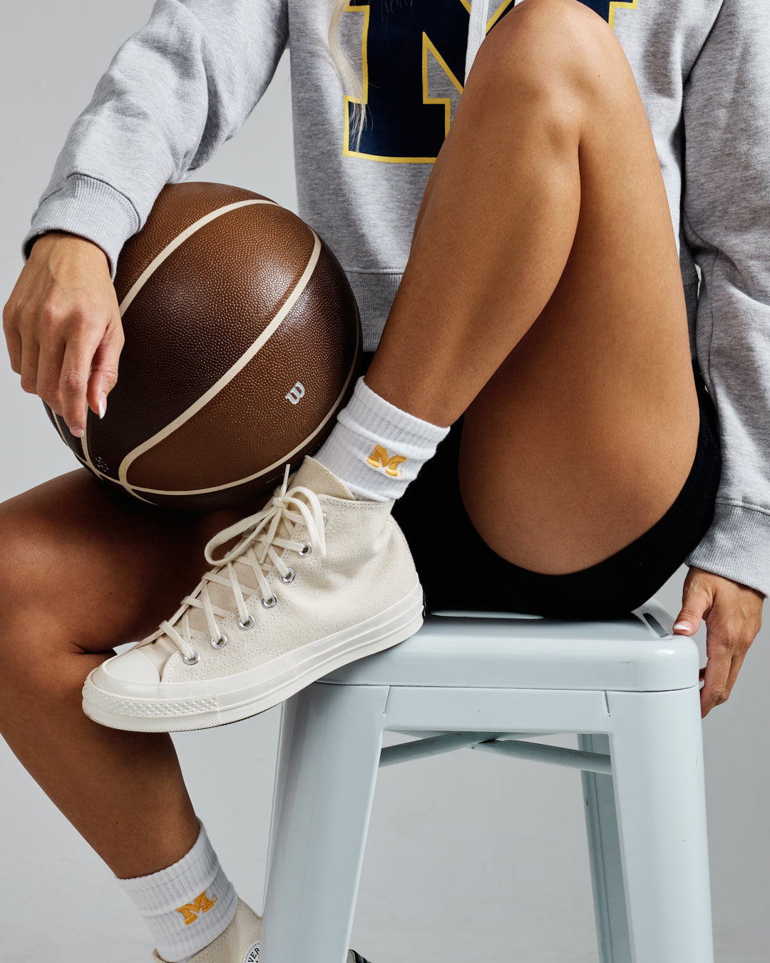 White crew sock with Michigan Wolverines patch, perfect for campus and lounging