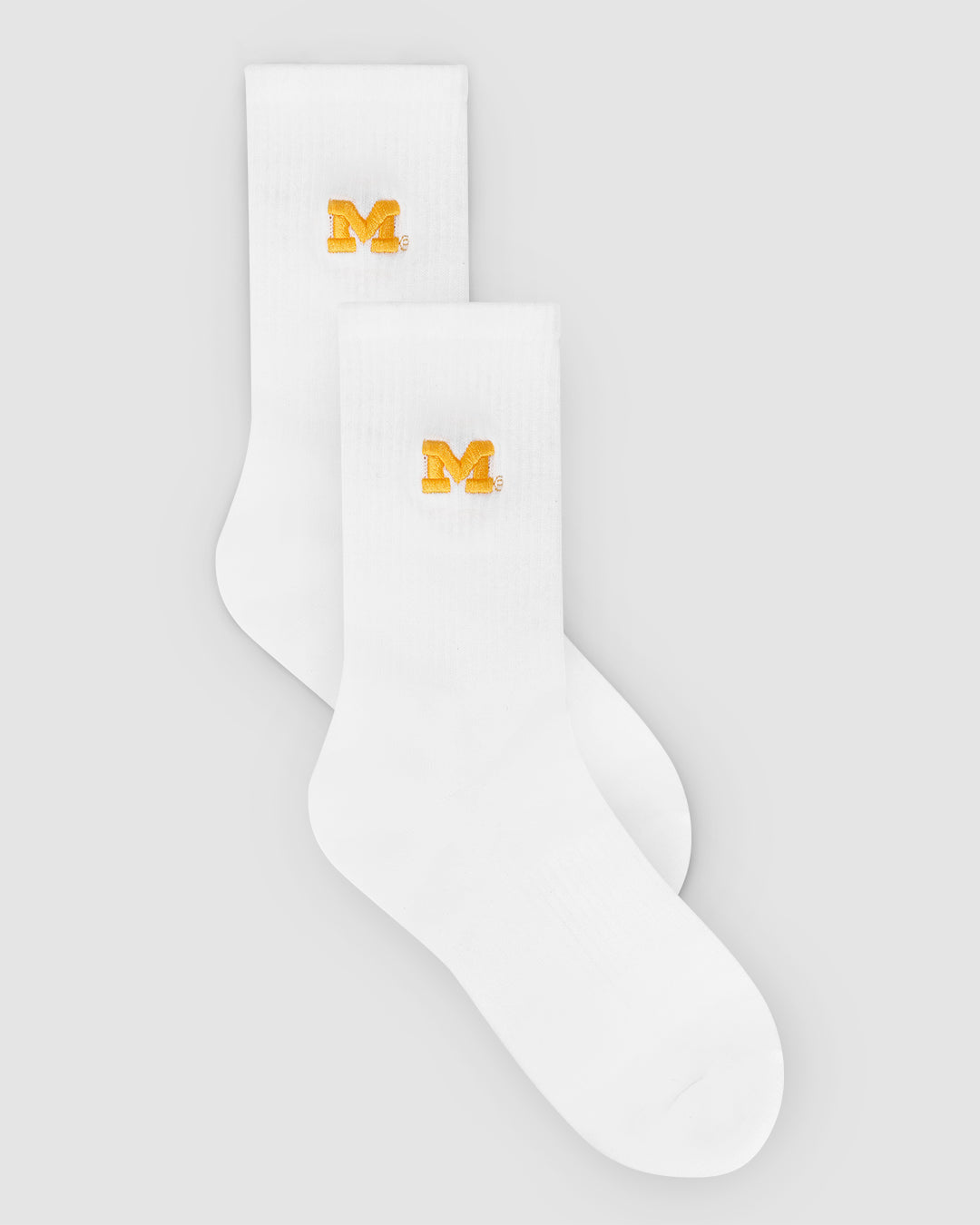White crew sock with Michigan Wolverines patch, perfect for campus and lounging