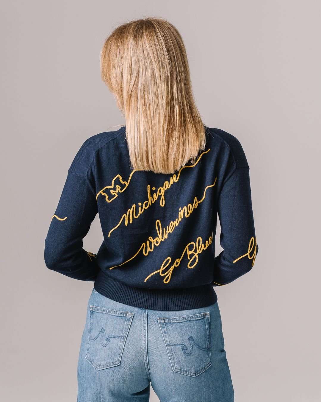 navy crewneck sweater with michigan wolverines embroidery, perfect for college game day looks and tailgates