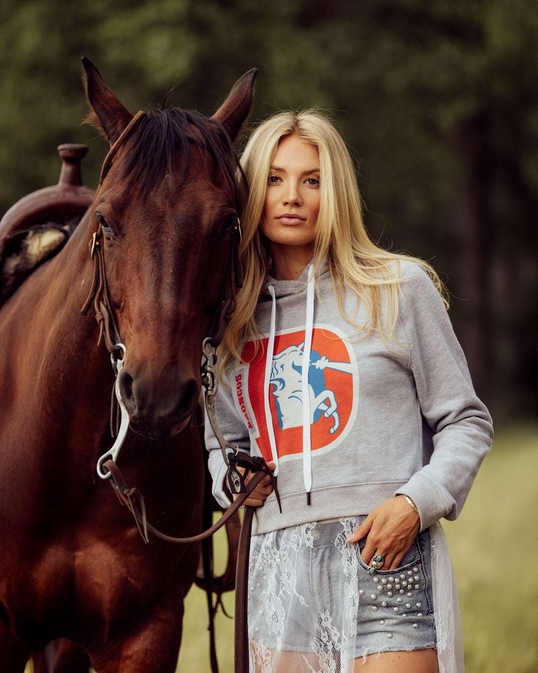 gray denver broncos crop womens hoodie with denver broncos D emblem, styled for game day, casual wear, and tailgates.