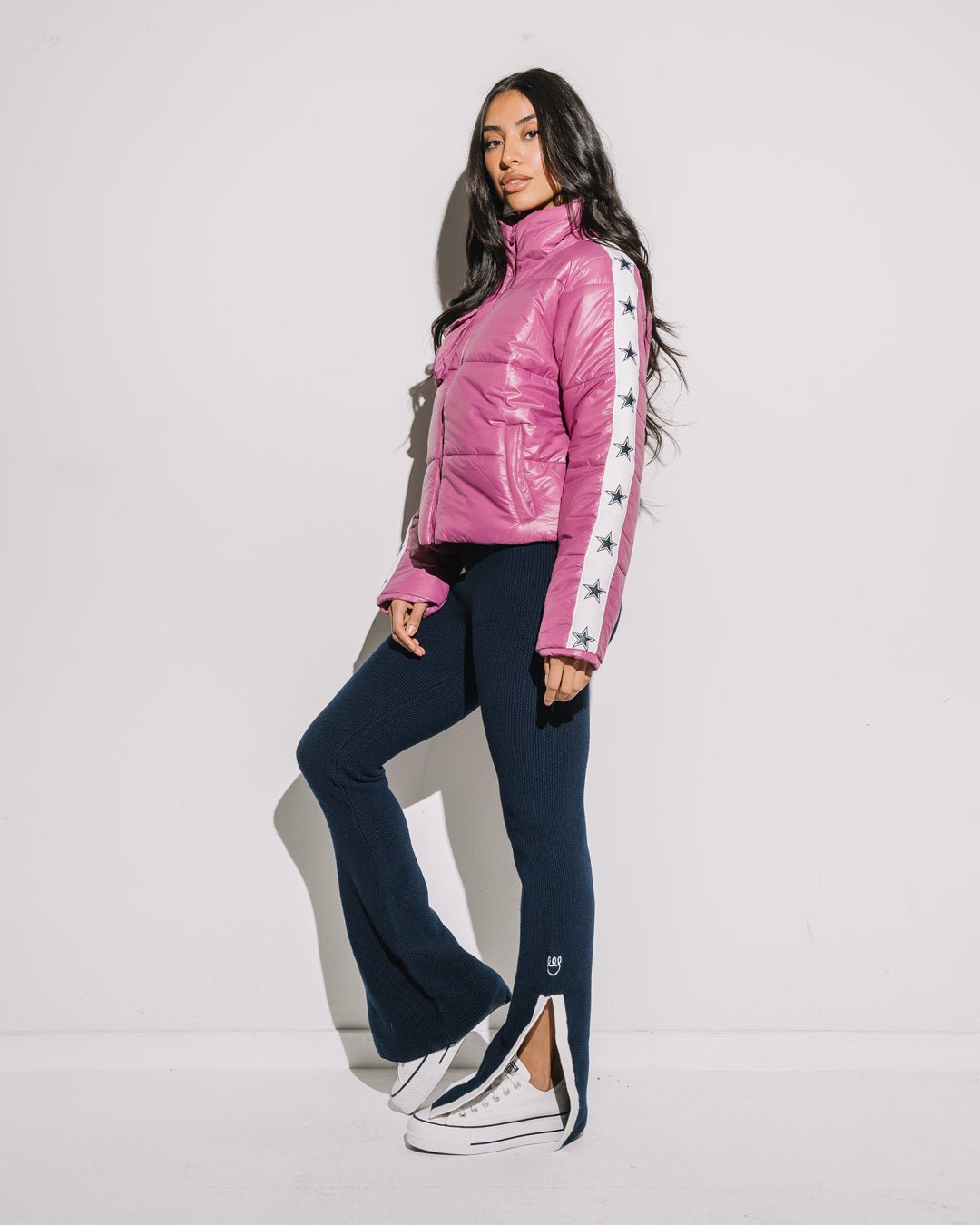 Pink cargo puffer featuring Dallas Cowboys insignia, styled for tailgates, game day, or casual wear.