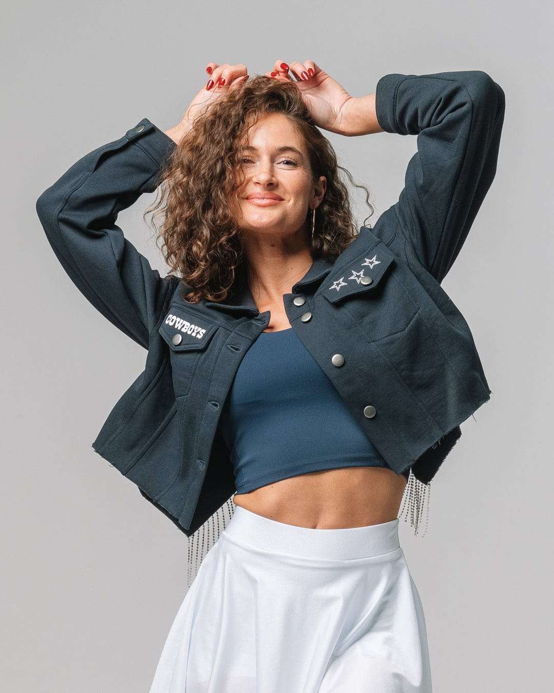 Navy rhinestone jacket with Dallas Cowboys logo, ideal for tailgates, city streets, or game day flair.