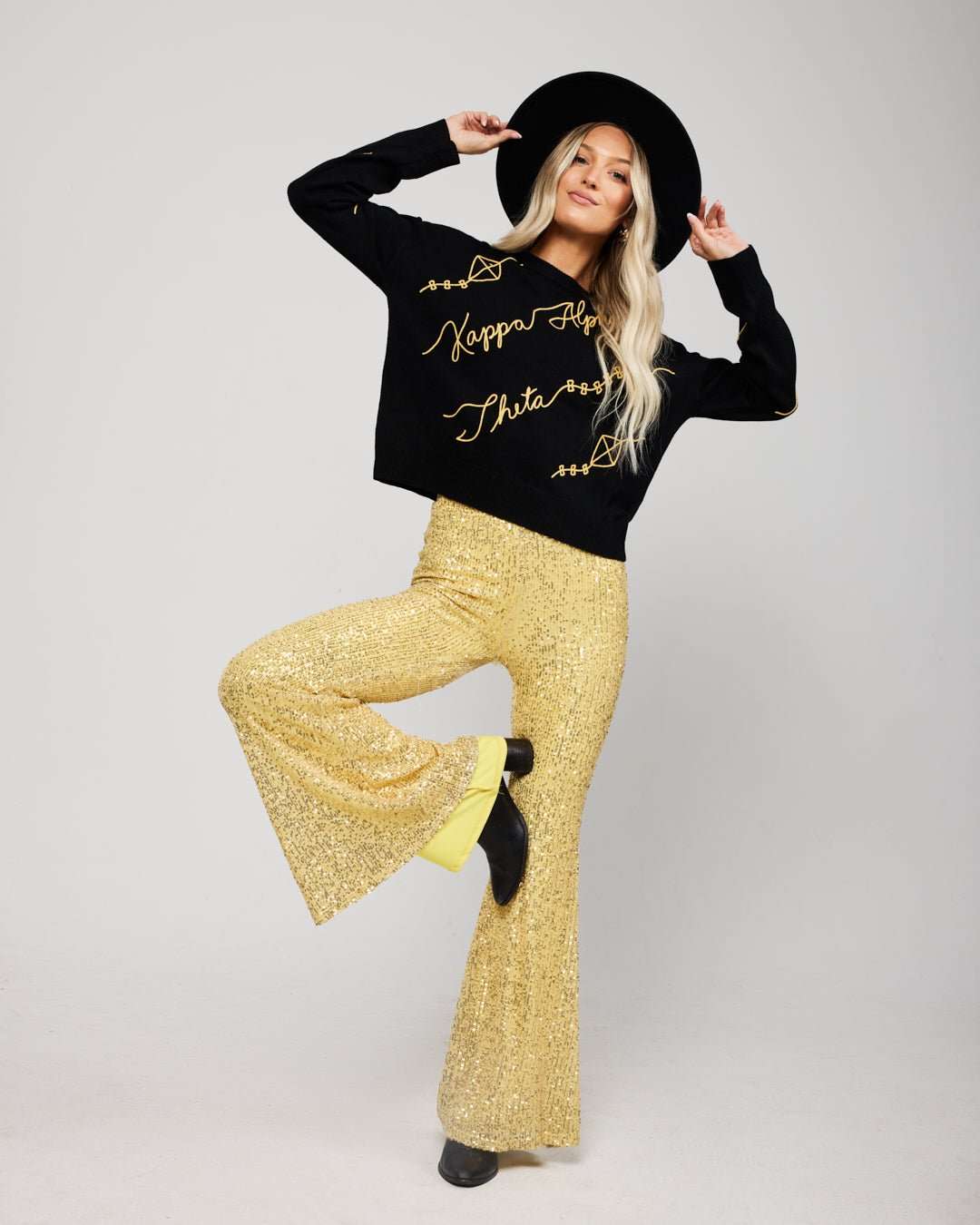 black and gold long sleeve sorority sweater with Kappa Alpha Theta embroidered logo, perfect for sorority sisterhood events