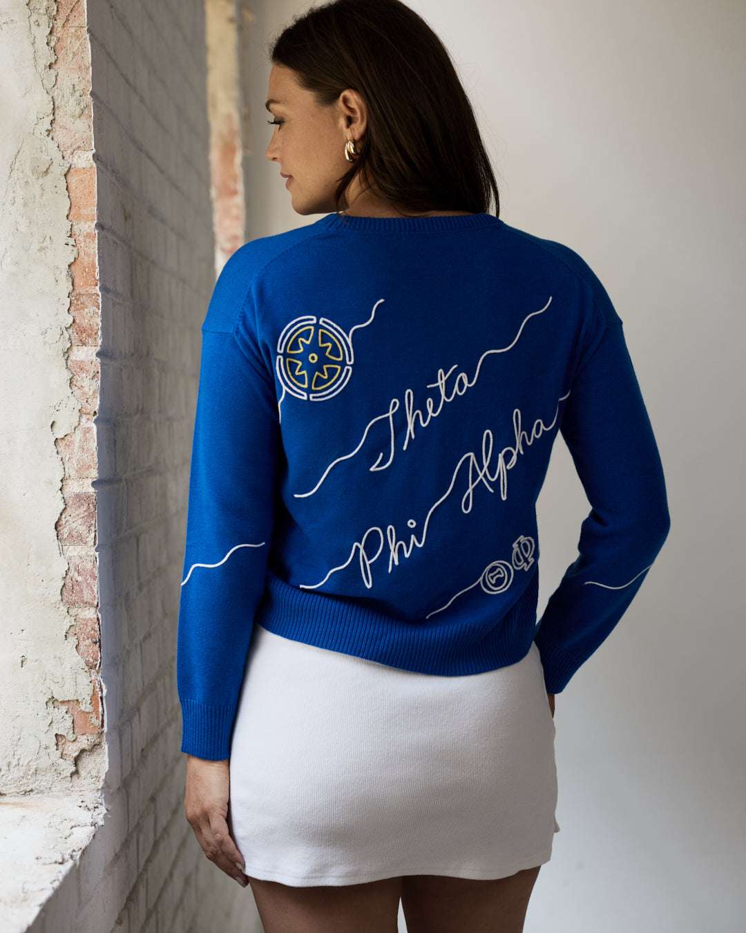 blue and white long sleeve sorority sweater with Theta Phi Alpha embroidered logo, perfect for sorority founders day celebration