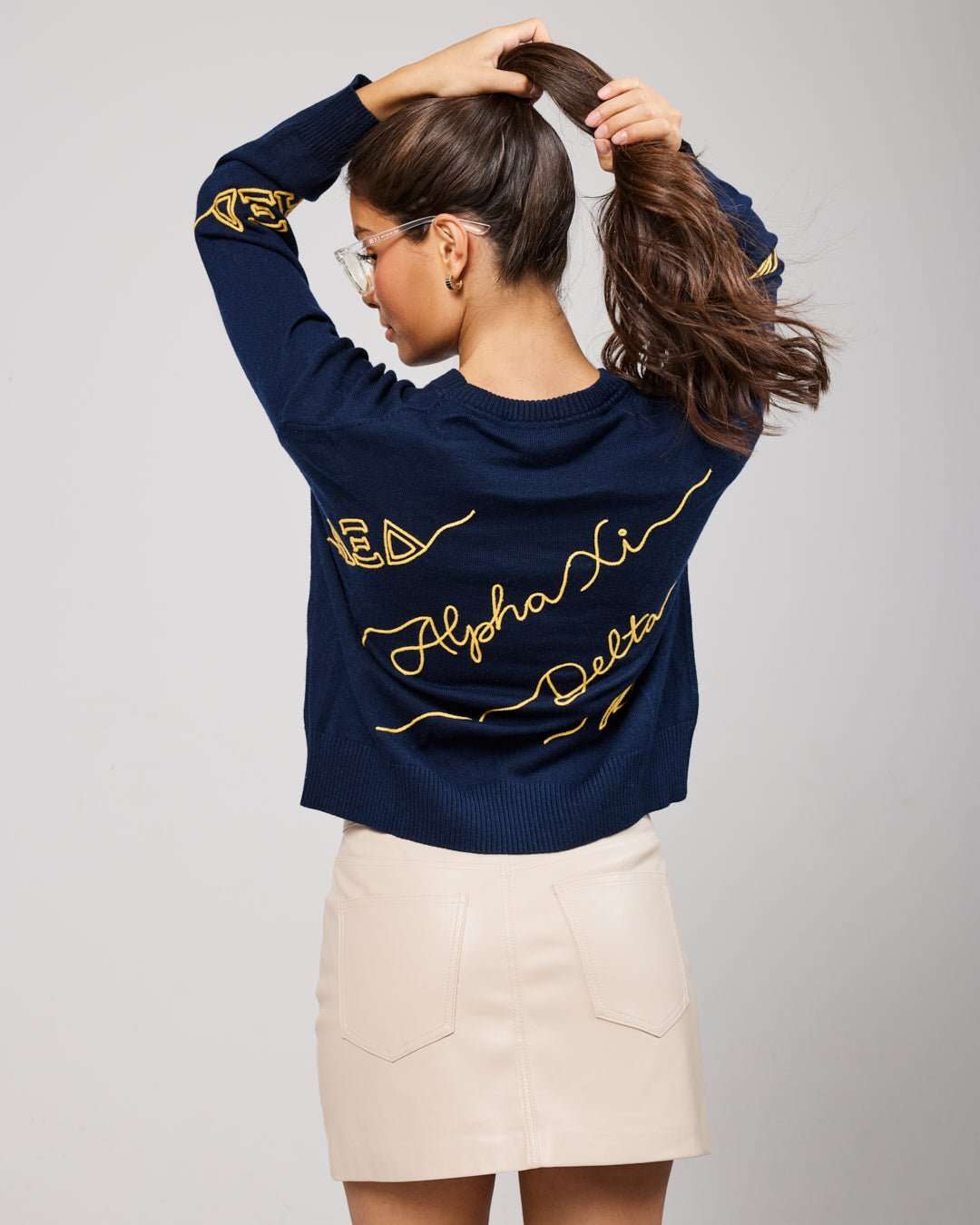 navy and gold long sleeve sorority sweater with Alpha Xi Delta embroidered logo, perfect for sorority alumni events