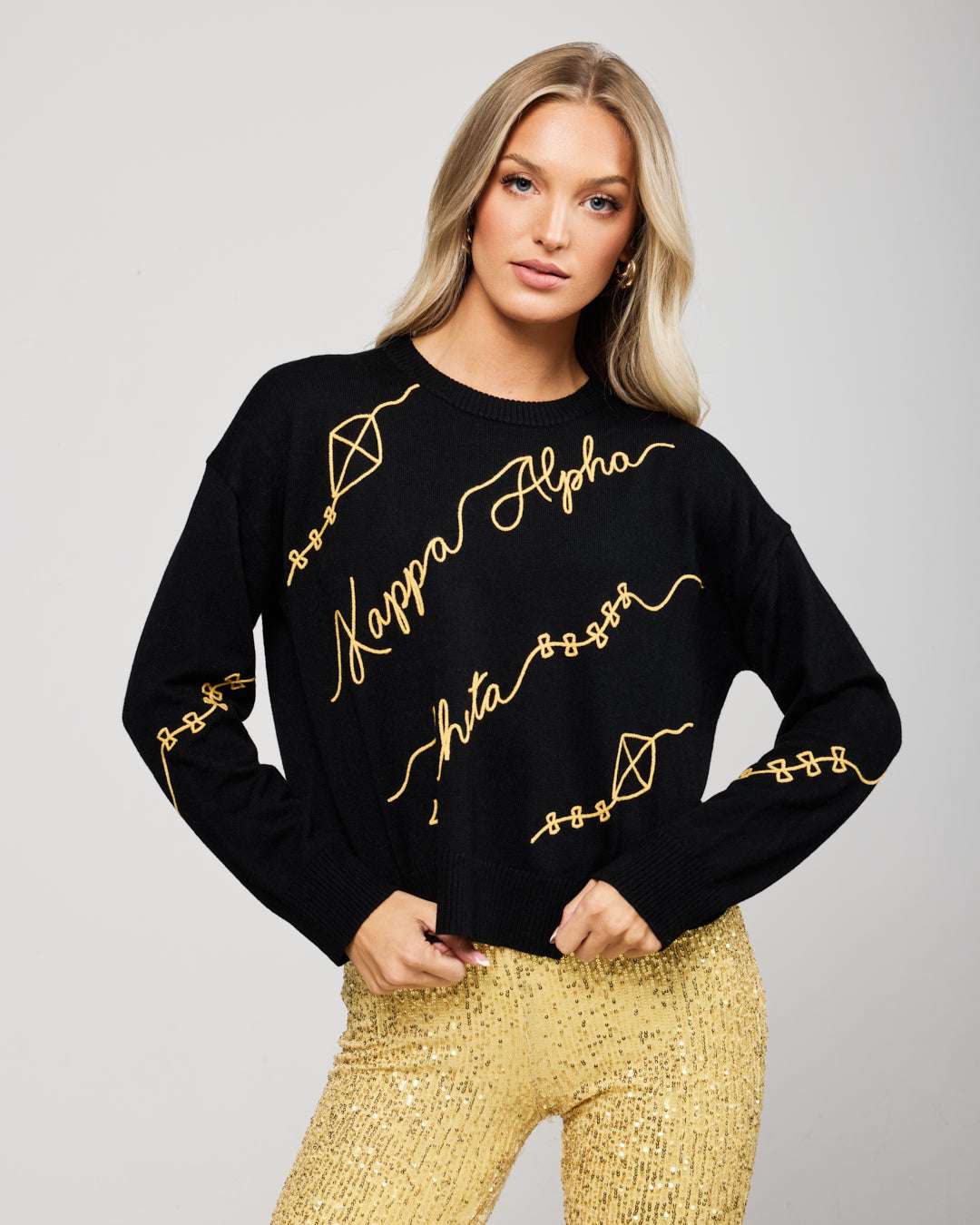 black and gold long sleeve sorority sweater with Kappa Alpha Theta embroidered logo, perfect for sorority sisterhood events