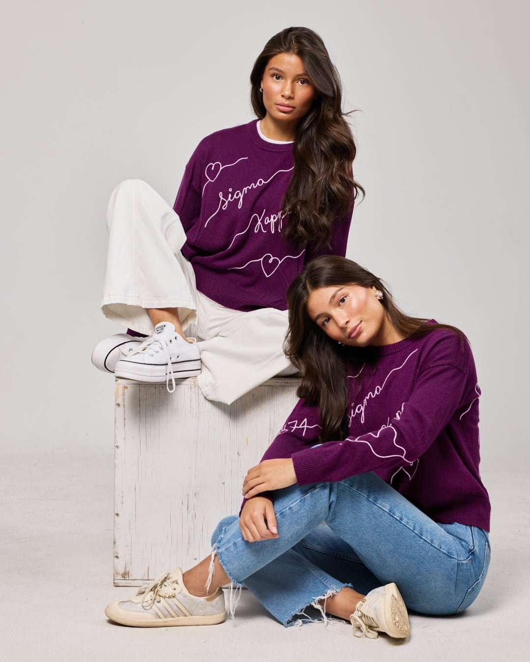 purple and pink crewneck sorority sweater with Sigma Kappa embroidered logo, perfect for dorm move in day