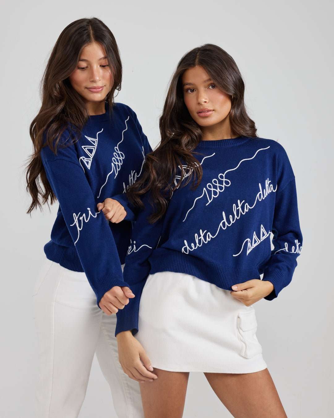 blue and white long sleeve sorority sweater with Tri Delta embroidered logo, perfect for sorority alumni tailgate