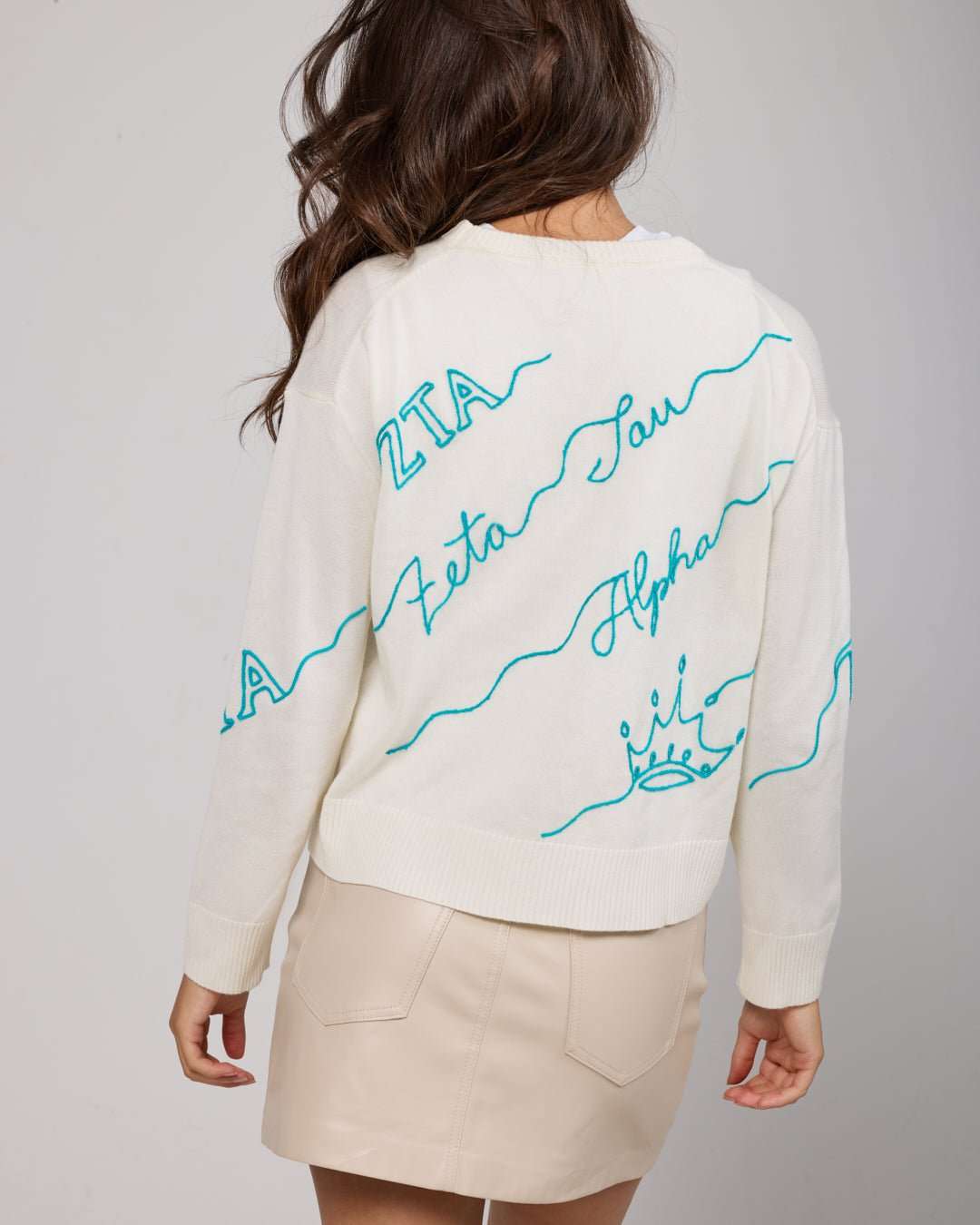 white and blue crewneck sorority sweater with Zeta Tau Alpha embroidered logo, perfect for sorority philanthropy event