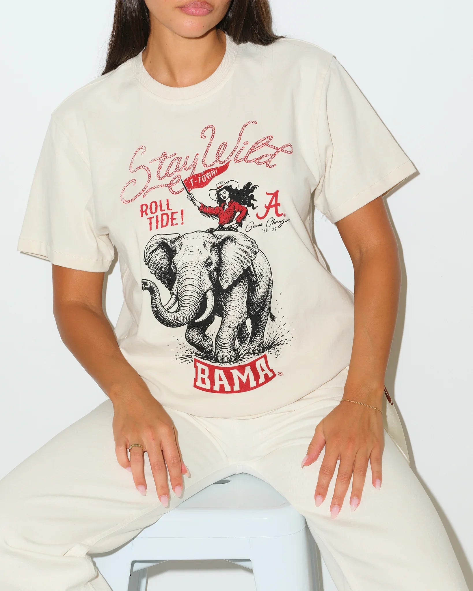 Bone oversized tee featuring Alabama Crimson Tide graphics with an elephant mascot, "Roll Tide" and "Bama" text in red and gray lettering.