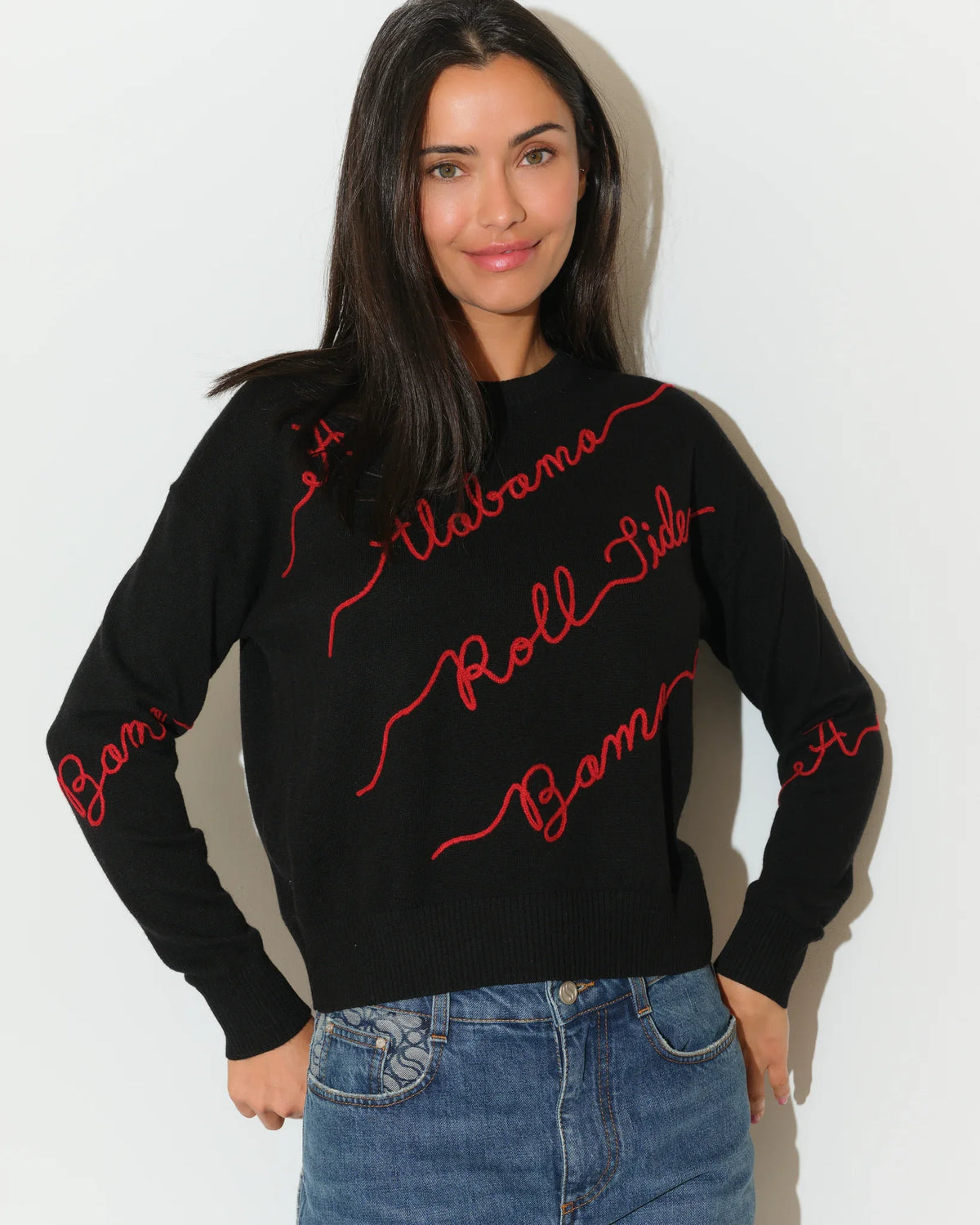 Black Alabama Crimson Tide Love Letter Sweater with red cursive script reading "Alabama," "Roll Tide," and "Bama" across the front and sleeves.