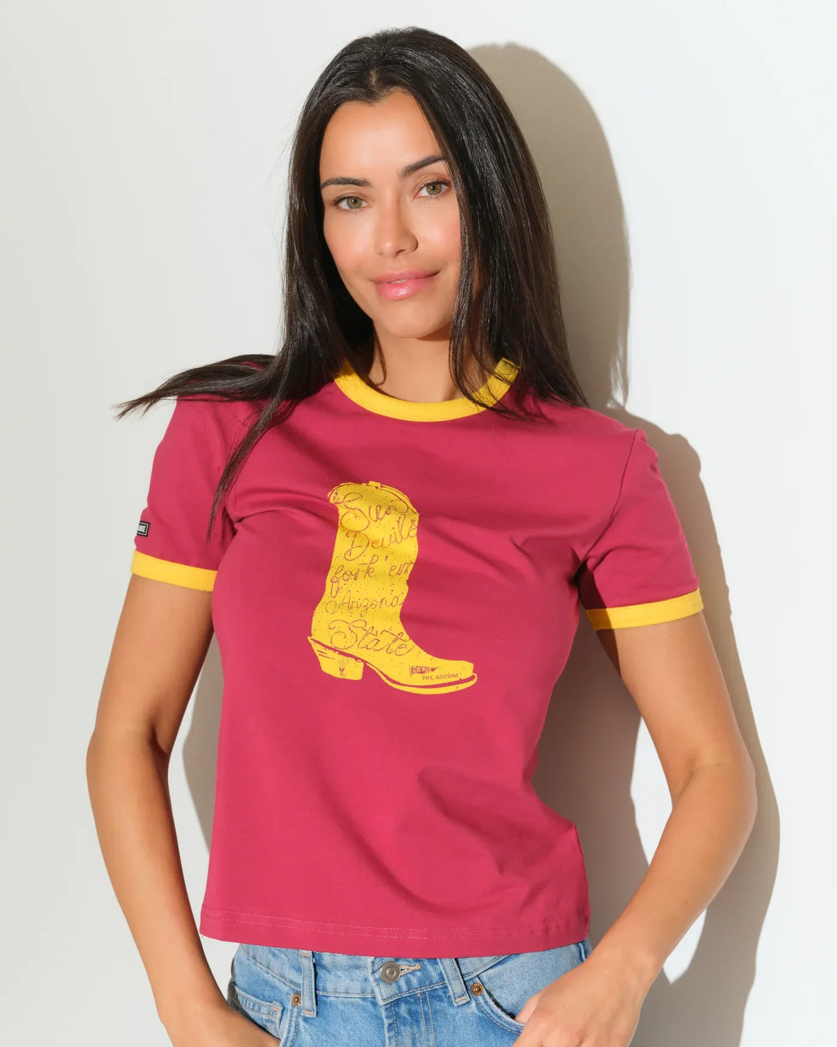 Maroon Arizona State Sun Devils women's ringer tee with gold trim and a bold gold cowboy boot graphic on the chest.