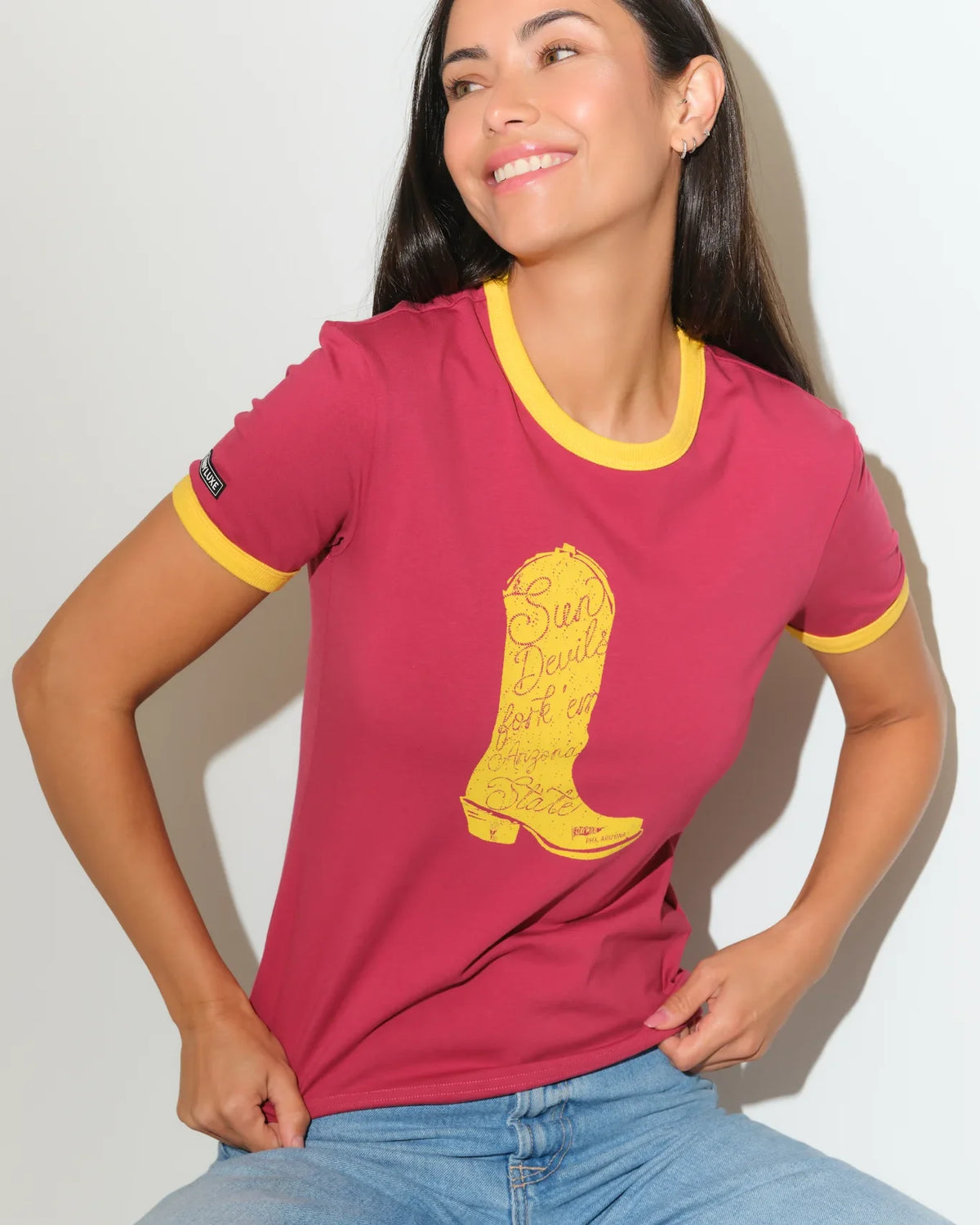 Maroon Arizona State Sun Devils women's ringer tee with gold trim and a bold gold cowboy boot graphic on the chest.