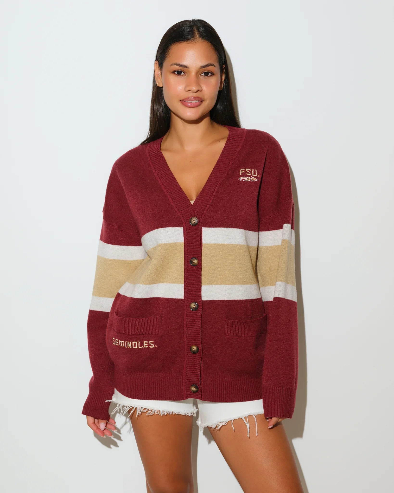 Maroon Florida State Seminoles oversized cardigan with tan and cream chest stripes, button front, and embroidered team lettering on the chest and sleeve.
