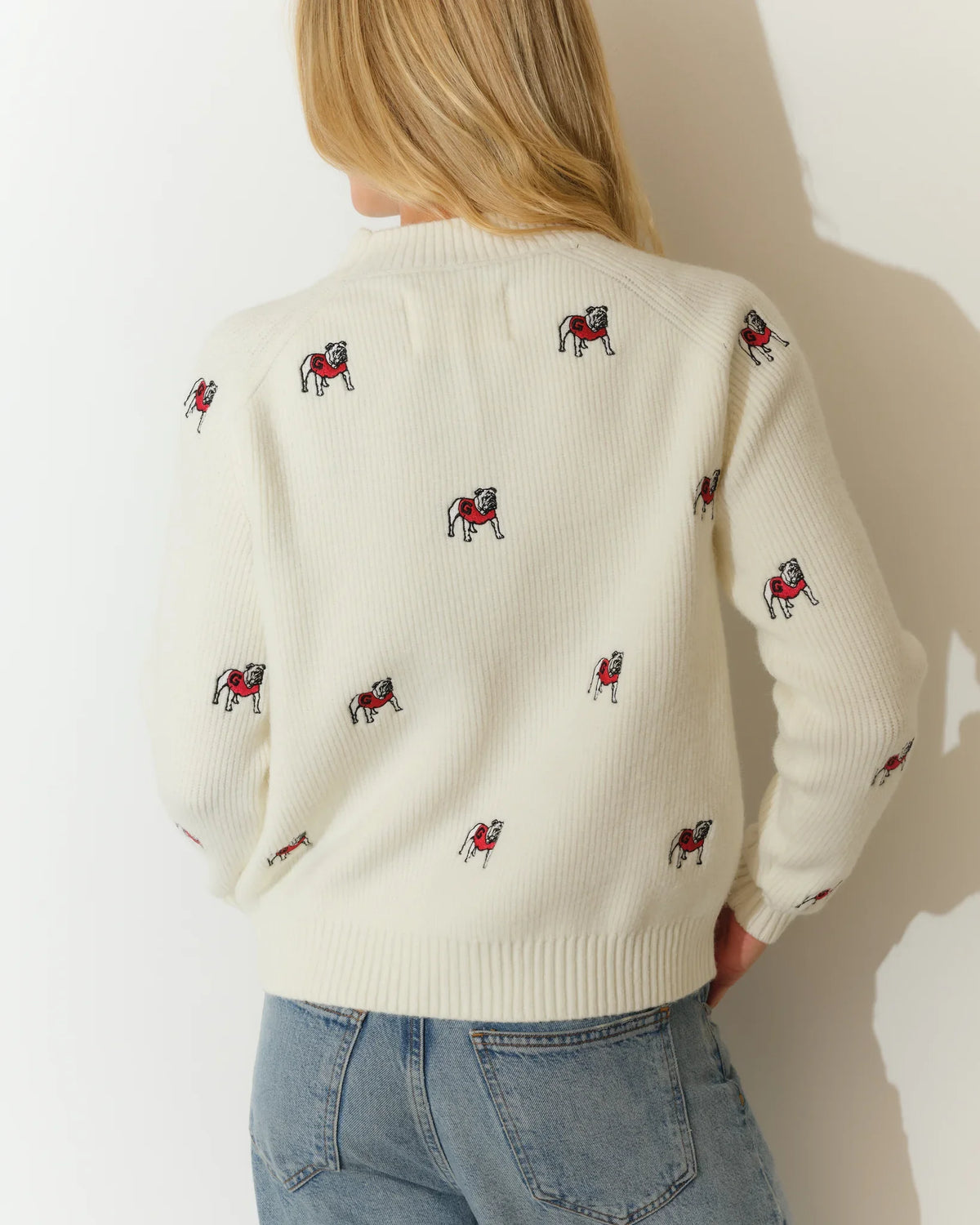 Ivory Georgia Bulldogs fisherman sweater with allover embroidered bulldog mascots, featuring a crew neck and ribbed hem.