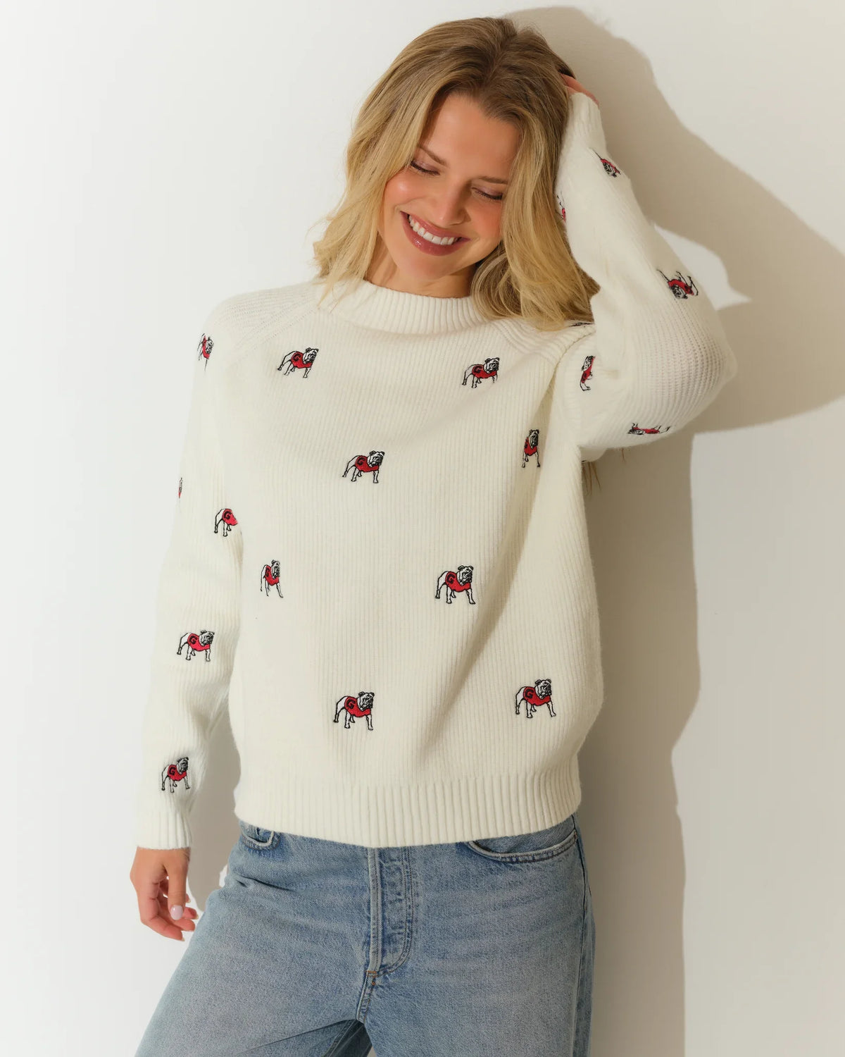 Ivory Georgia Bulldogs fisherman sweater with allover embroidered bulldog mascots, featuring a crew neck and ribbed hem.