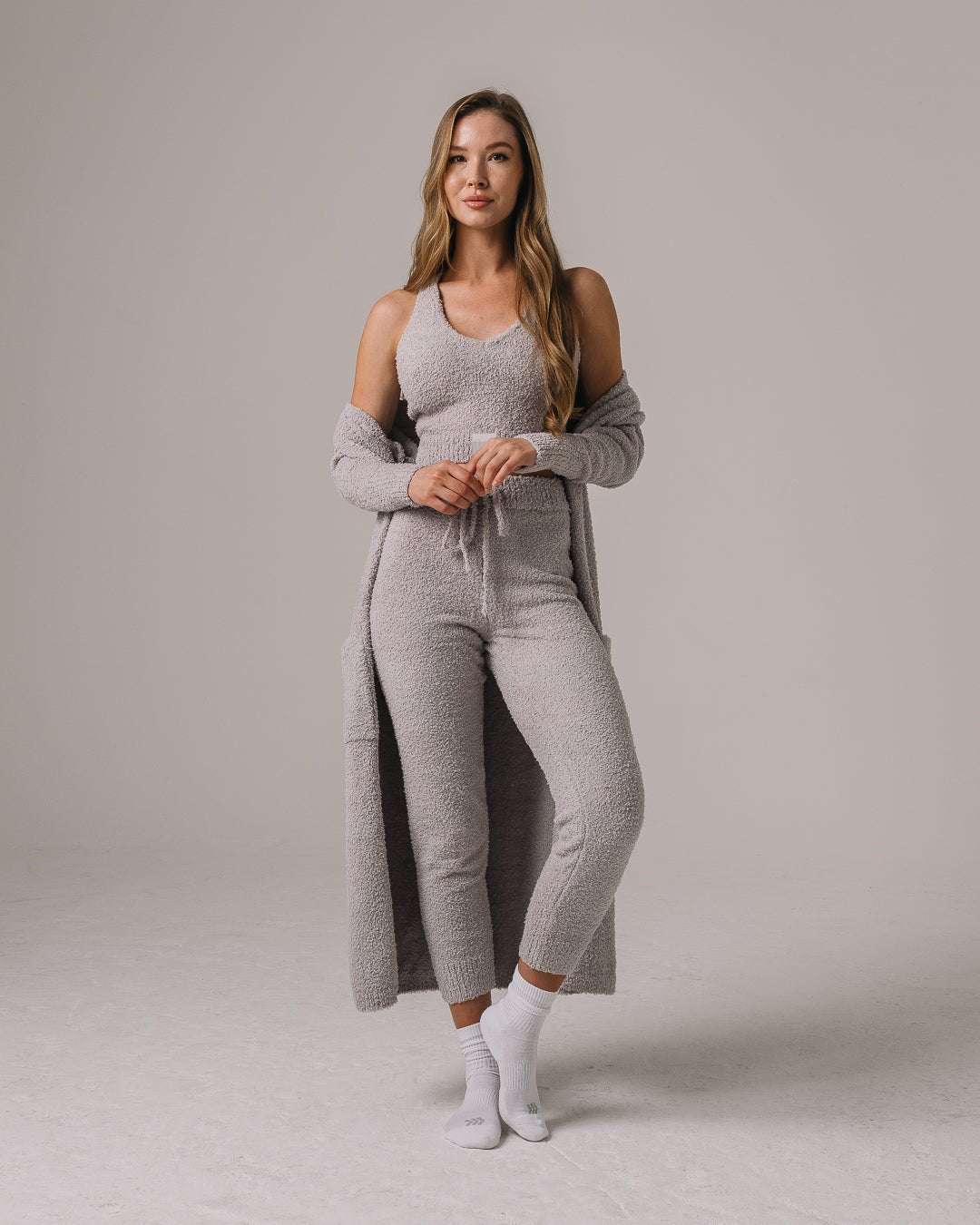 Gray fuzzy knit lounge set with Miami Hurricanes patch, ultra-soft and perfect for relaxed game days or campus wear.