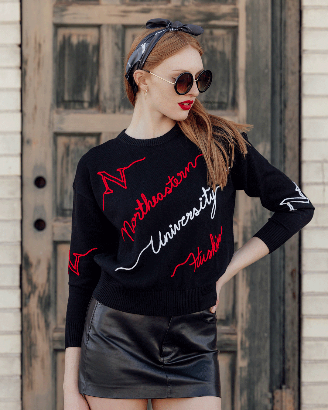 Black wool sweater with Northeastern Huskies embroidery, ultra-soft and perfect for game day or casual wear.