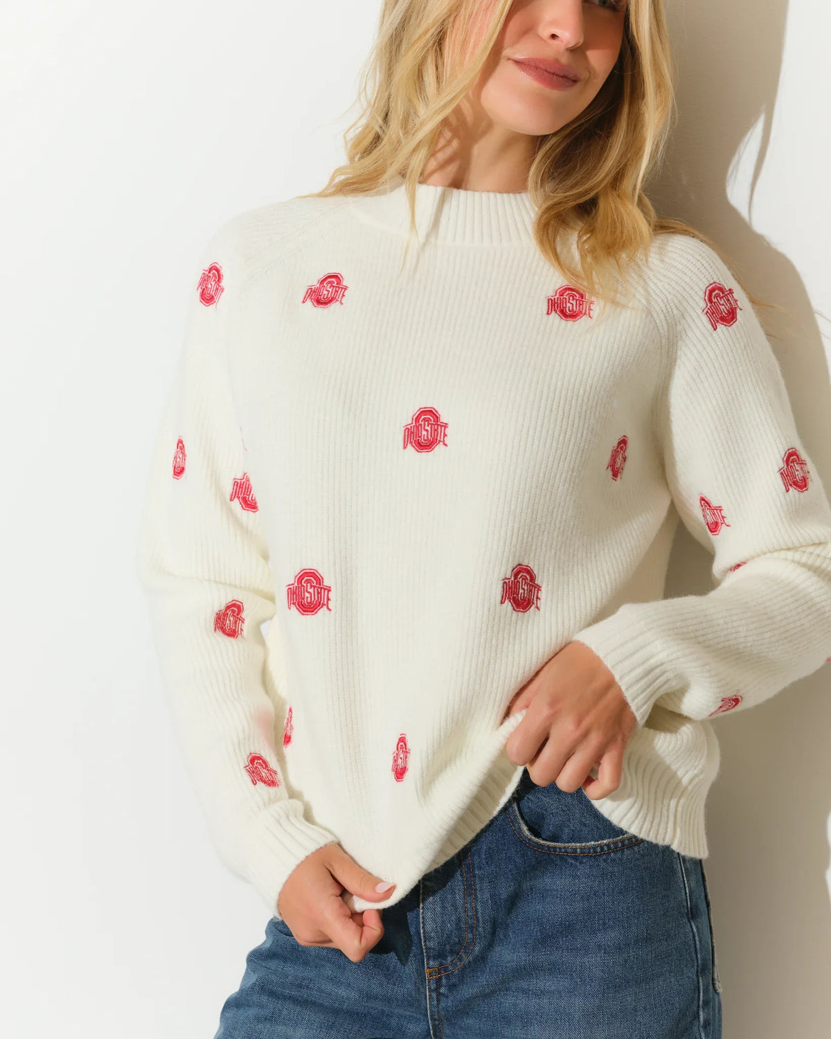 Ivory Ohio State Buckeyes fisherman sweater with scattered red Buckeye leaf embroidery, featuring a relaxed fit and ribbed cuffs.