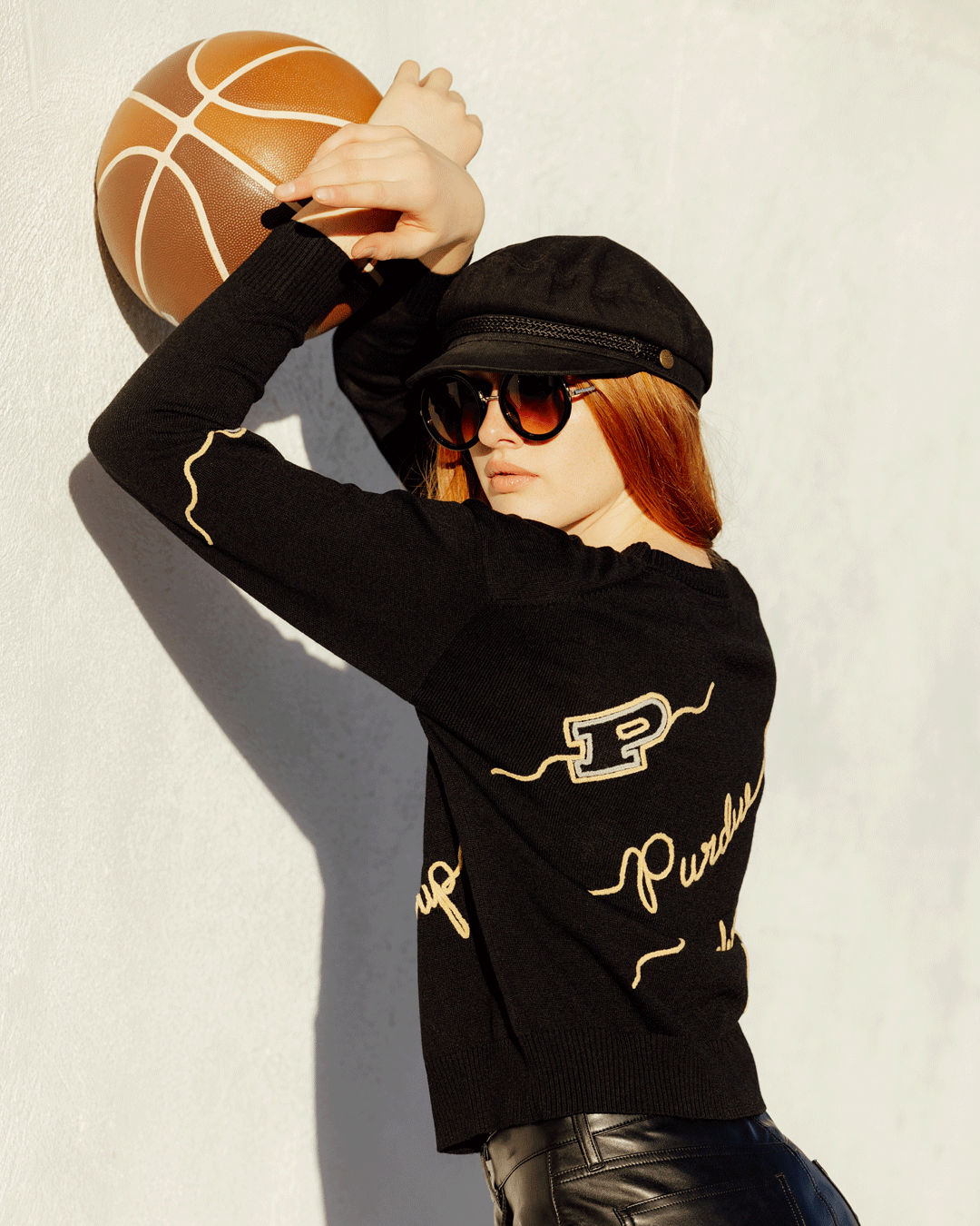 black long sleeve sweater with purdue boilermakers embroidery, styled for march madness and campus wear.