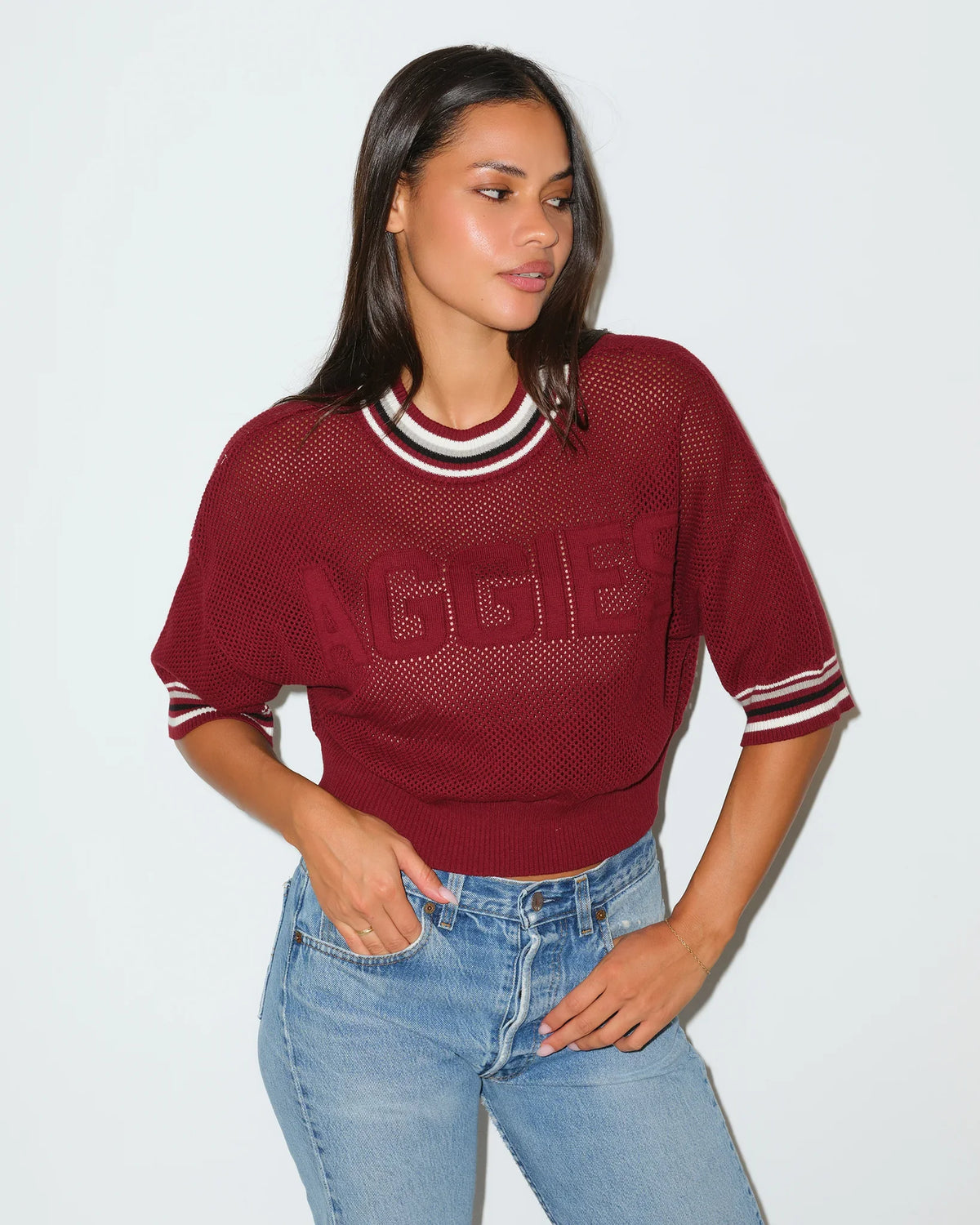 Maroon Texas A&M Aggies women's summer sweater with embossed "AGGIES" lettering, short sleeves, and striped ribbed collar.