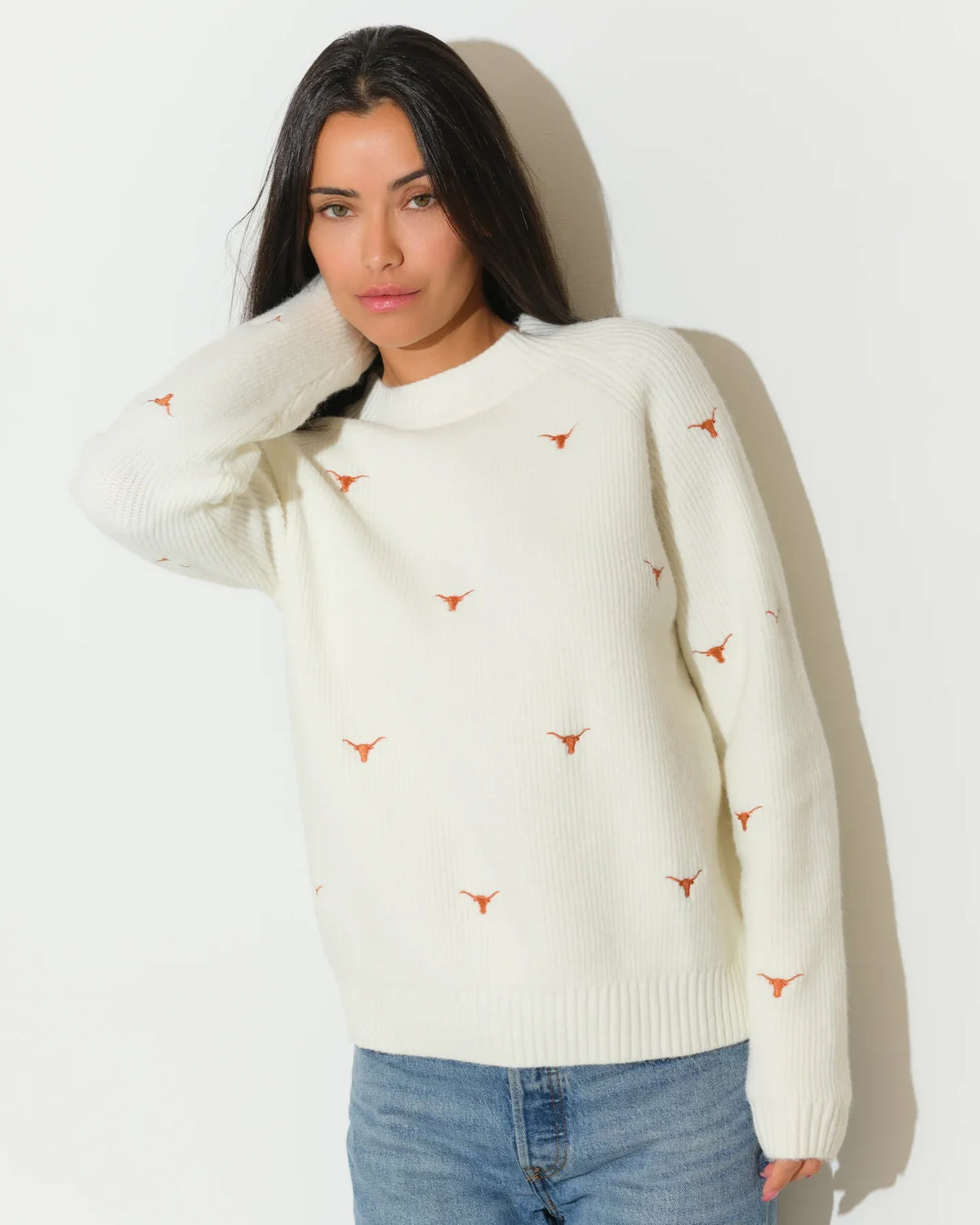 Ivory Texas Longhorns fisherman sweater featuring embroidered Longhorn logos, shown with a relaxed crew neck and ribbed cuffs.