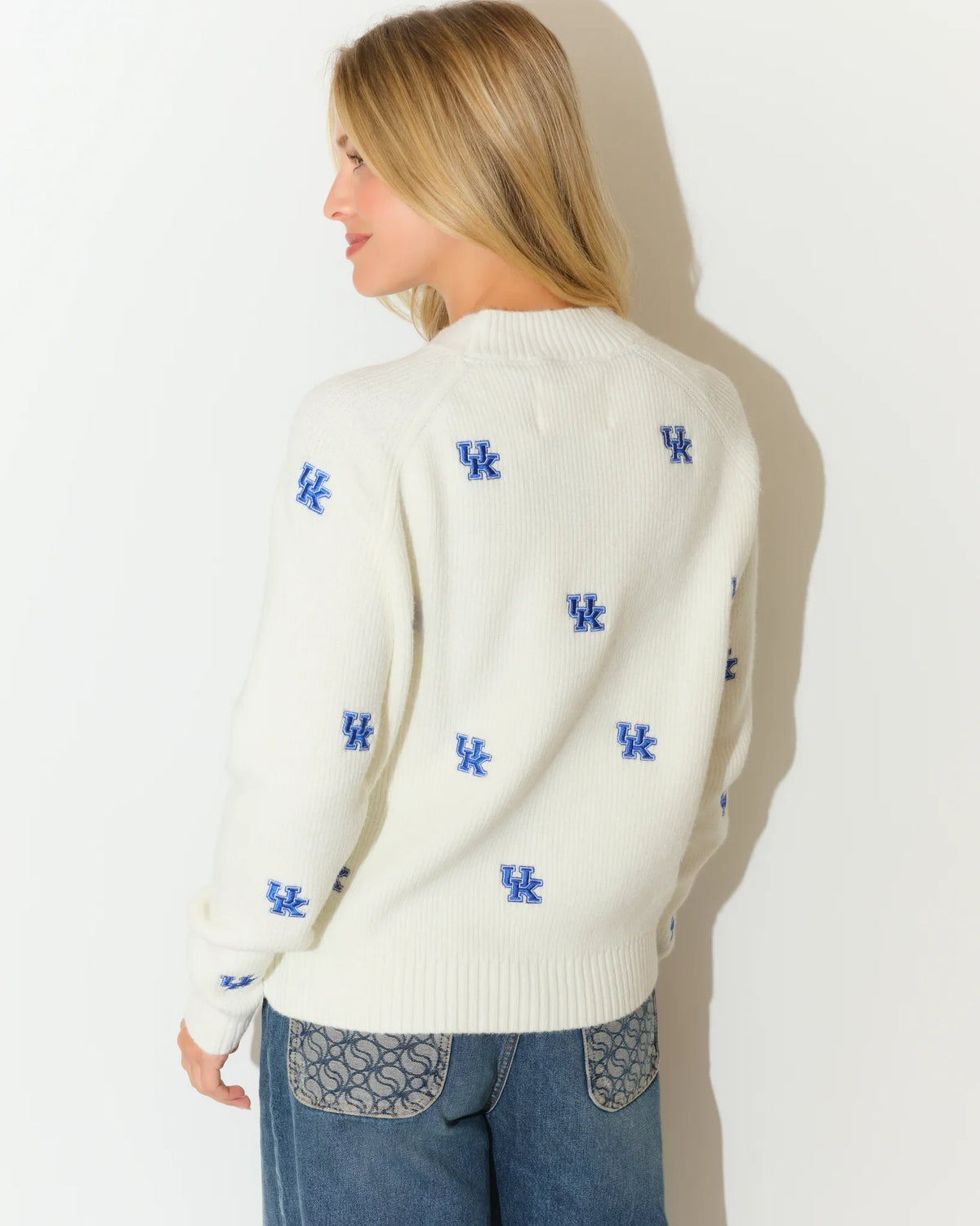 Ivory University of Kentucky fisherman sweater with allover blue UK logo embroidery, featuring a relaxed fit and mock neckline.