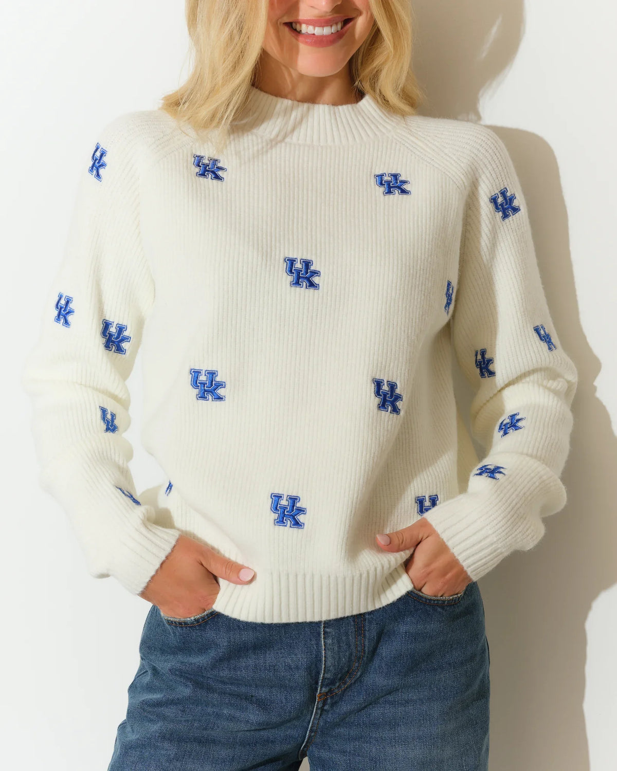 Ivory University of Kentucky fisherman sweater with allover blue UK logo embroidery, featuring a relaxed fit and mock neckline.