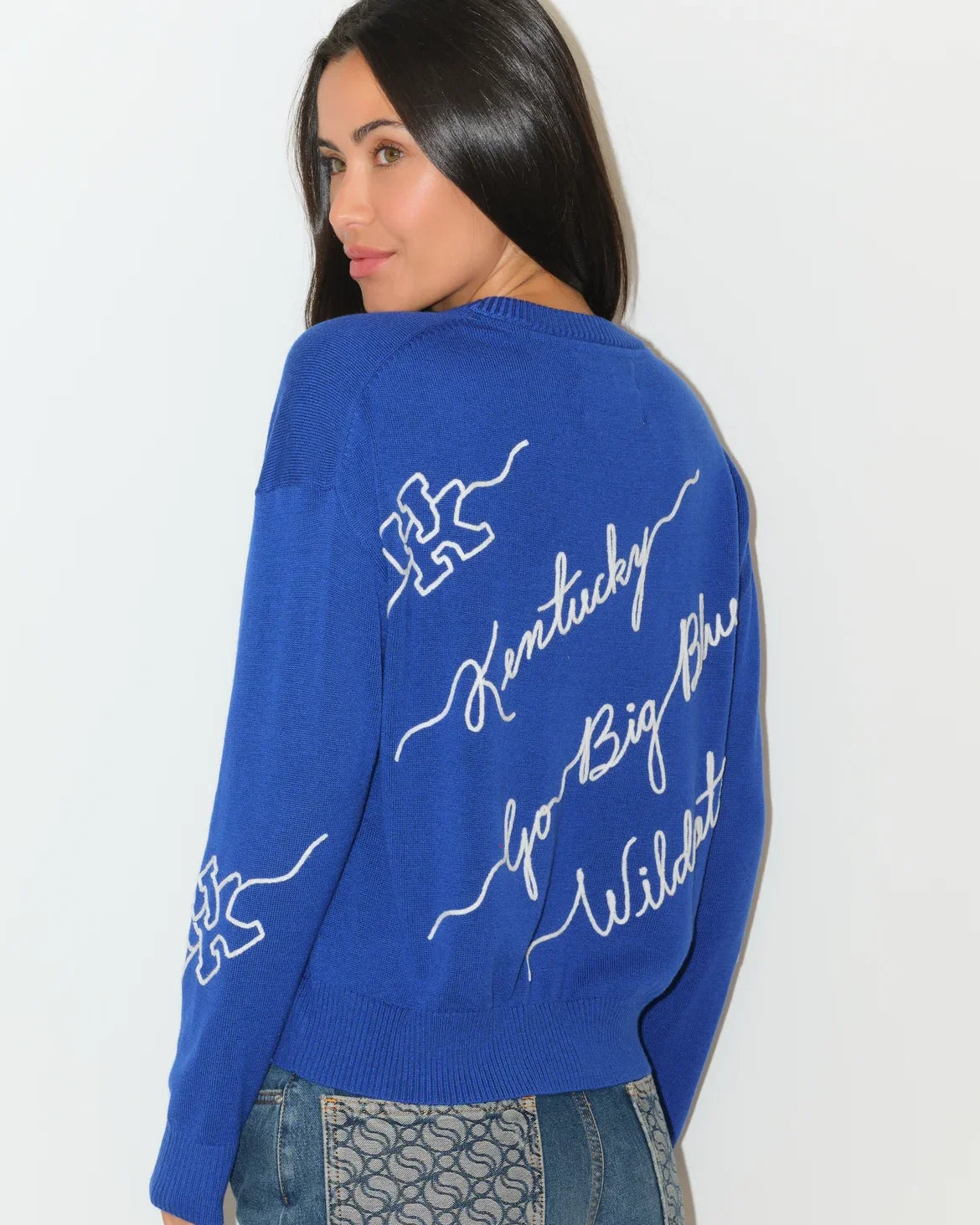 Royal blue University of Kentucky Love Letter Sweater with white cursive "Kentucky Go Big Blue Wildcats" script and wildcat graphics on sleeves.