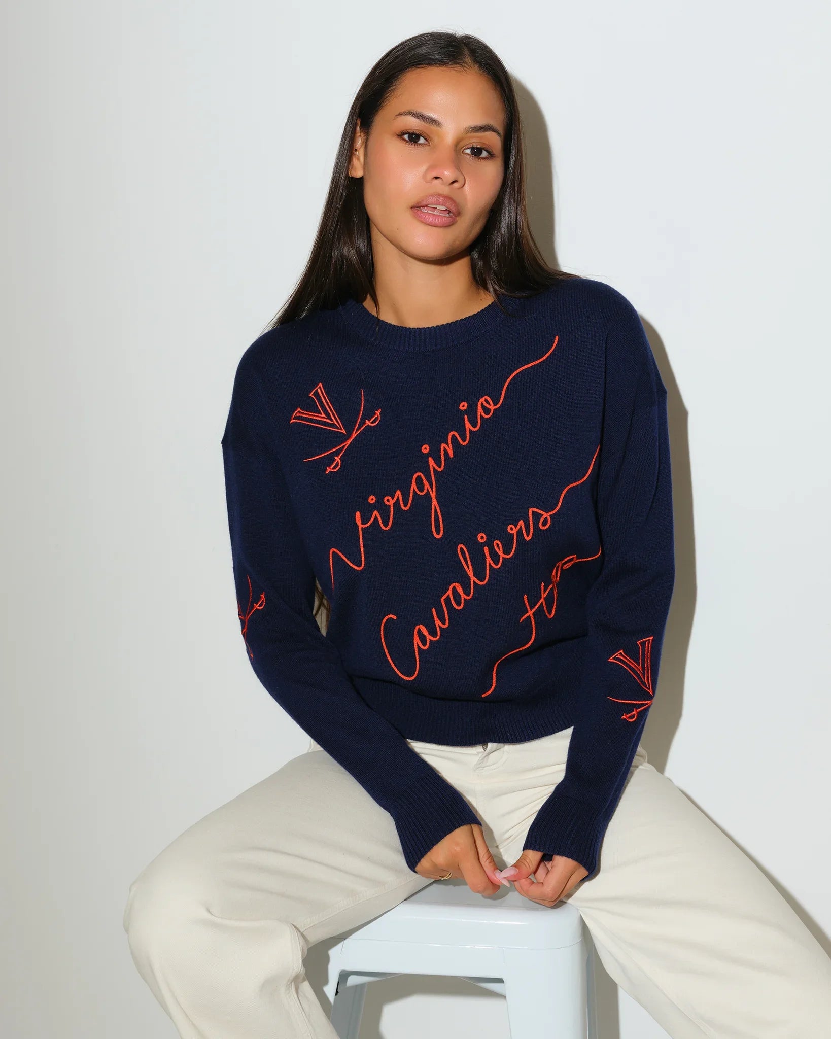 Navy Virginia Cavaliers crewneck sweater featuring red cursive "Virginia Cavaliers" script and logo details throughout.