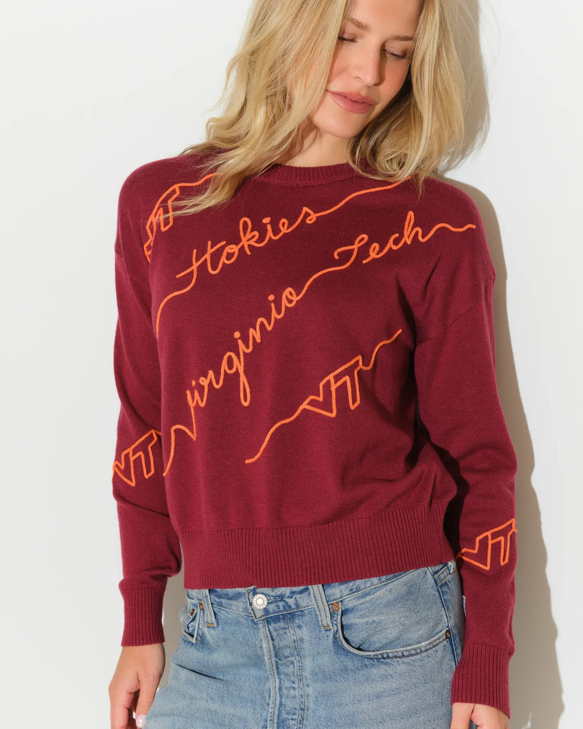 Maroon Virginia Tech crewneck sweater with diagonal orange script "Hokies," "Virginia Tech," and "VT" lettering across the front.