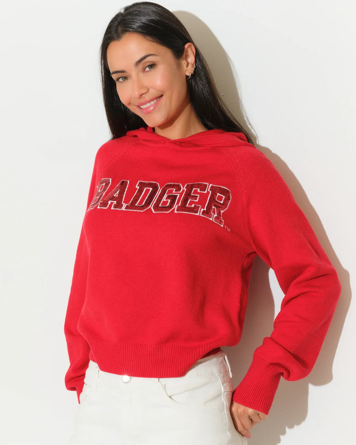 Red Wisconsin Badgers pullover hoodie with bold chenille "BADGERS" lettering across the chest, featuring a relaxed fit and front kangaroo pocket.