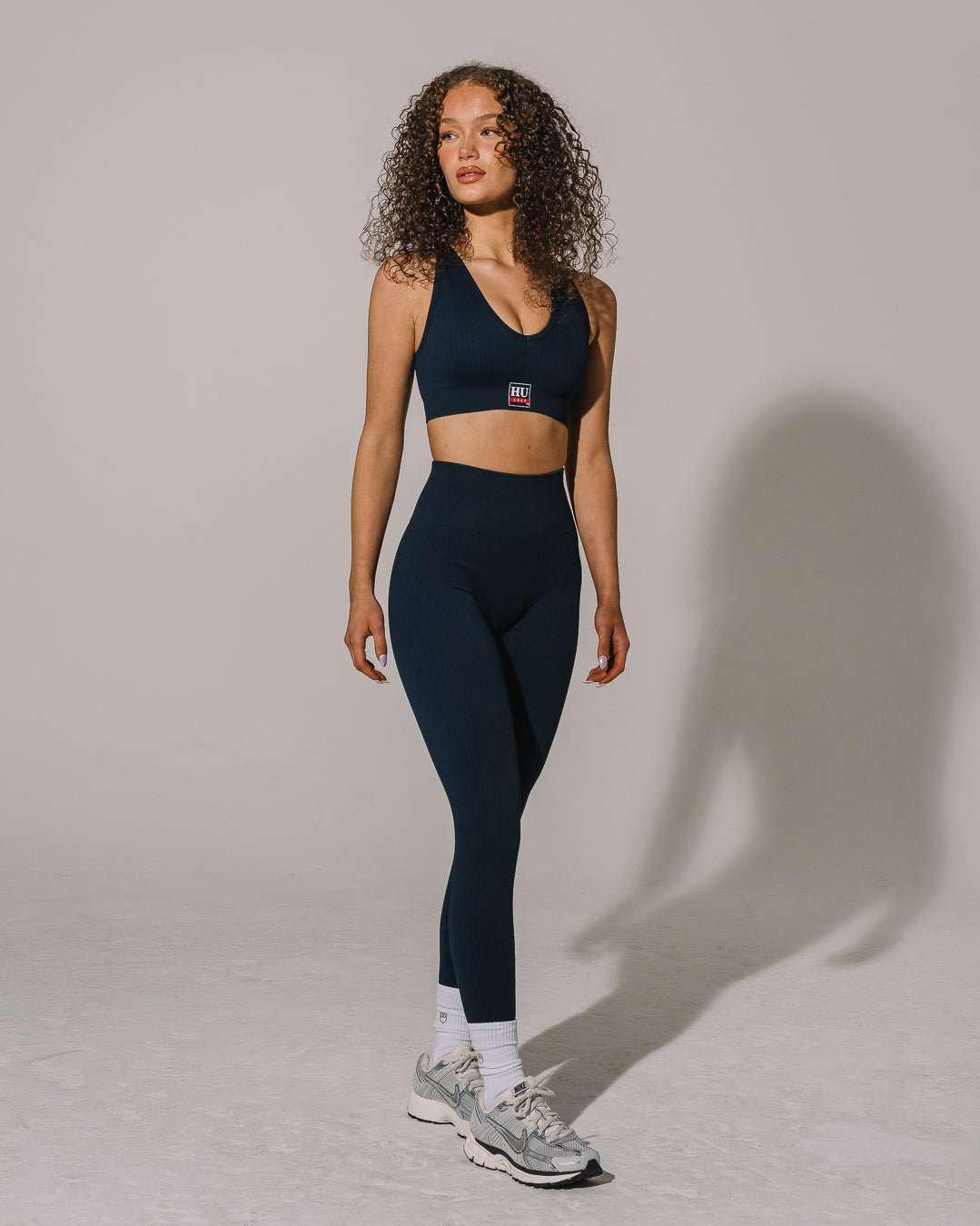 Navy seamless sports bra with Howard Bison patch, sleek and supportive for game day or workouts.