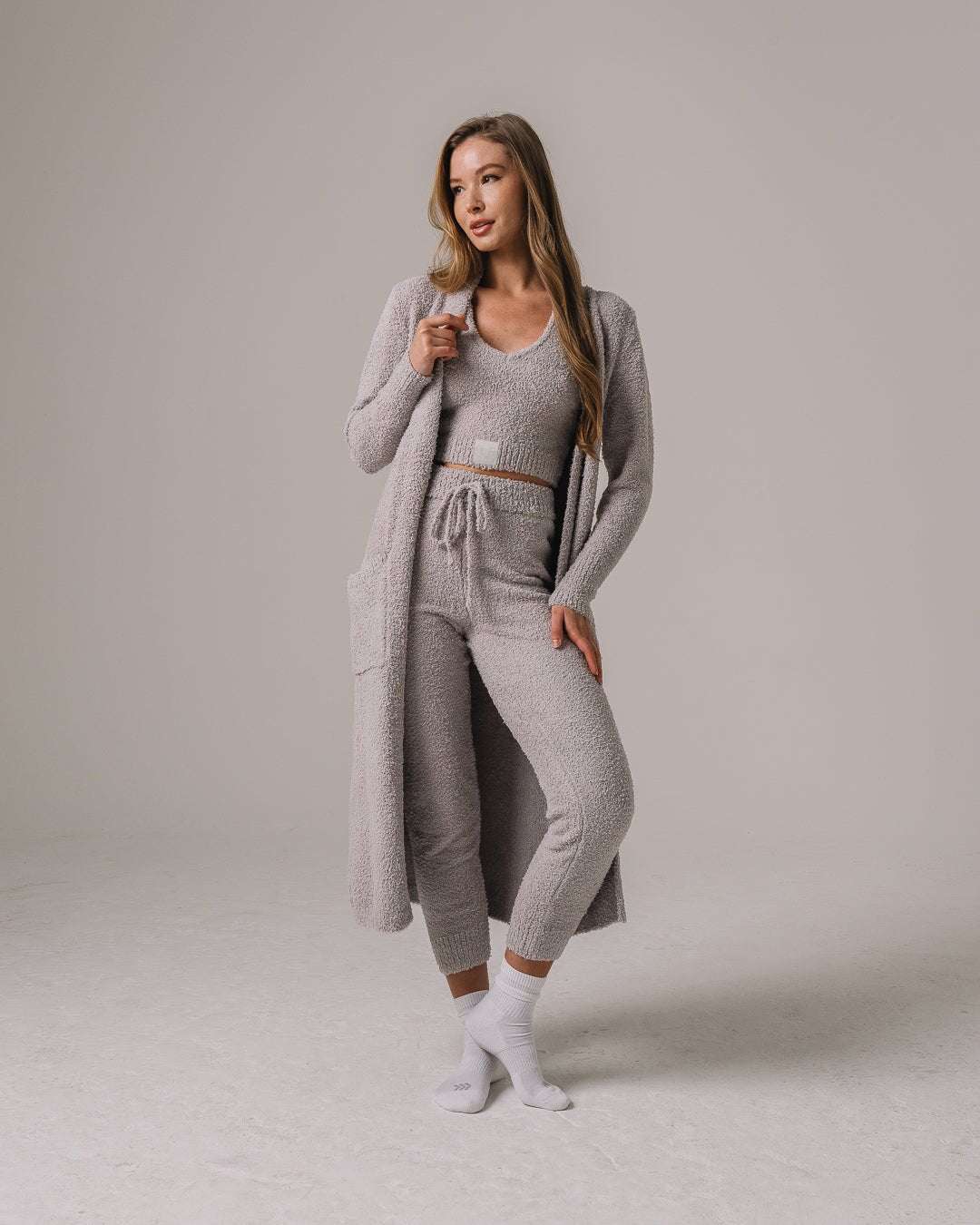 Gray fuzzy knit lounge set with Miami Hurricanes patch, ultra-soft and perfect for relaxed game days or campus wear.