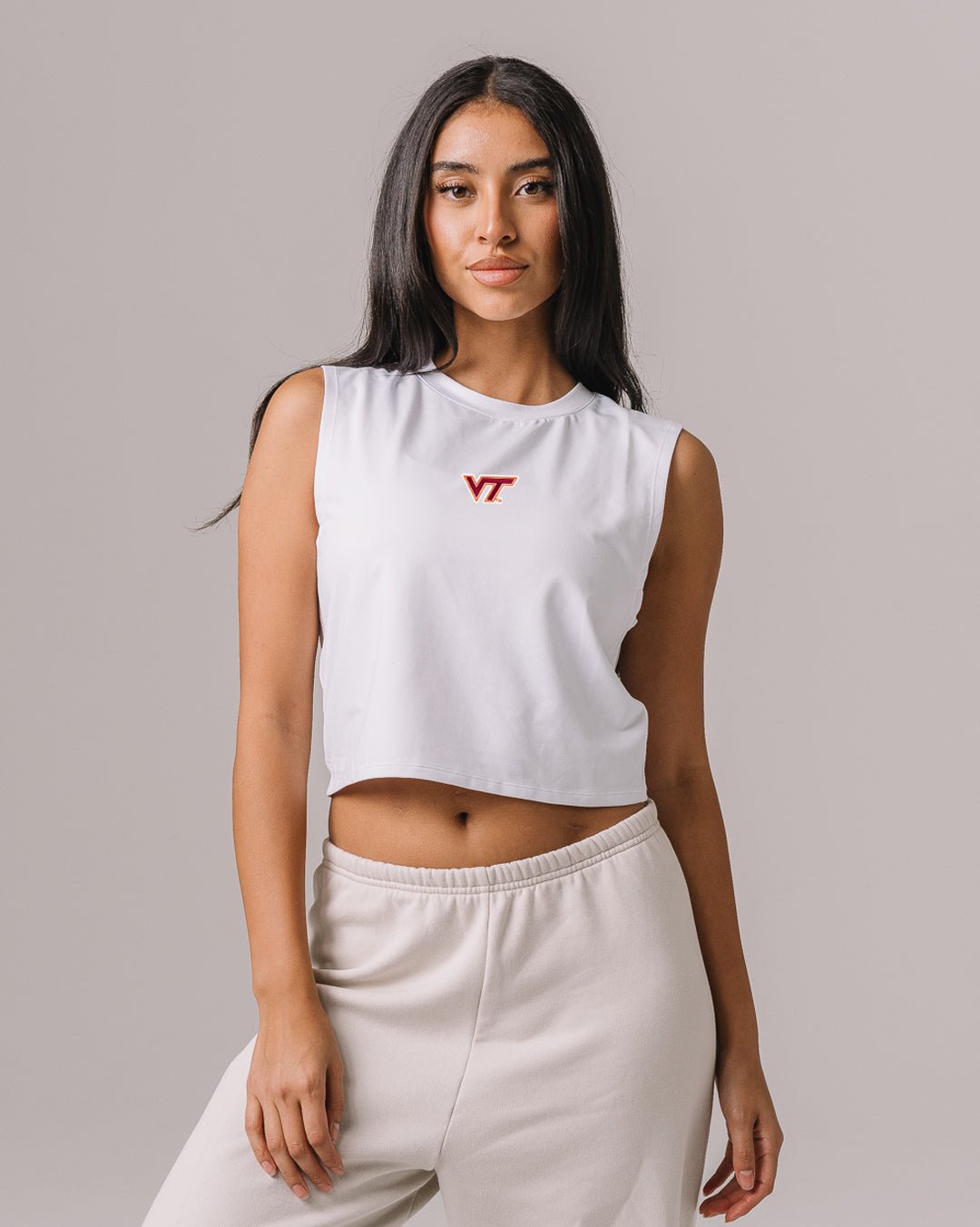 White Empower tank with Virginia Tech Hokies logo, styled for workouts or game day.