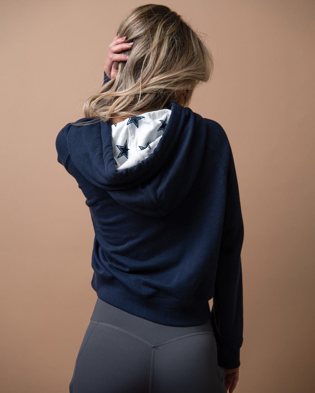 Navy sublimated hoodie with Dallas Cowboys star logo, perfect for game day, tailgates, or casual fan style.