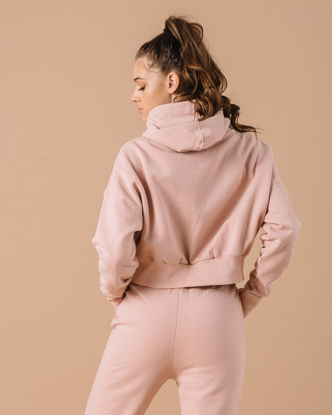 Pink hoodie with Dallas Cowboys star logo, great for casual fan style or weekend lounging.