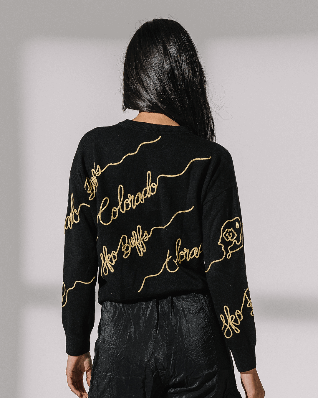 black long sleeve sweater with colorado buffaloes embroidery, perfect for college campus wear