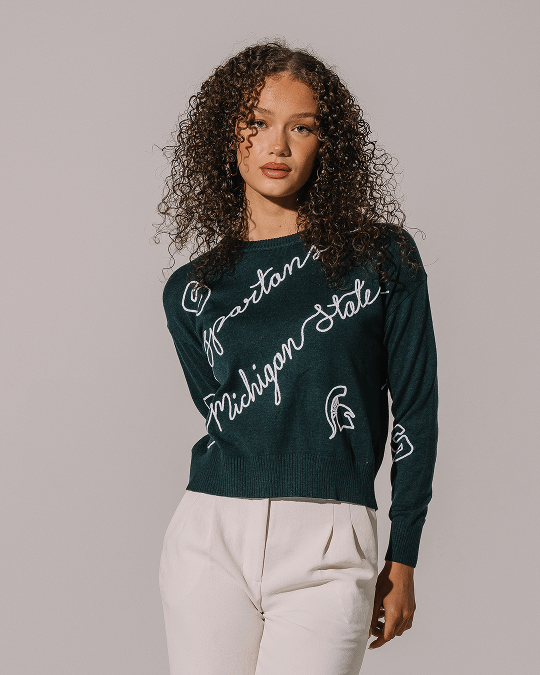 green long sleeve sweater with michigan state spartans embroidery, perfect for college game day looks