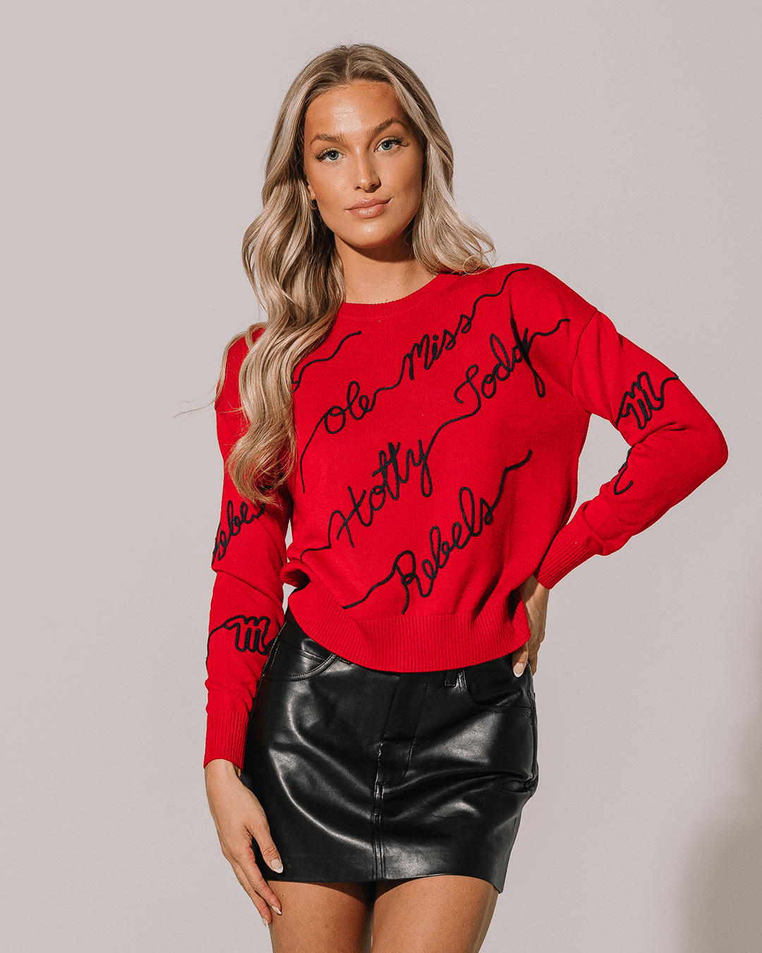 red crewneck sweater with ole miss embroidery, perfect for college game day