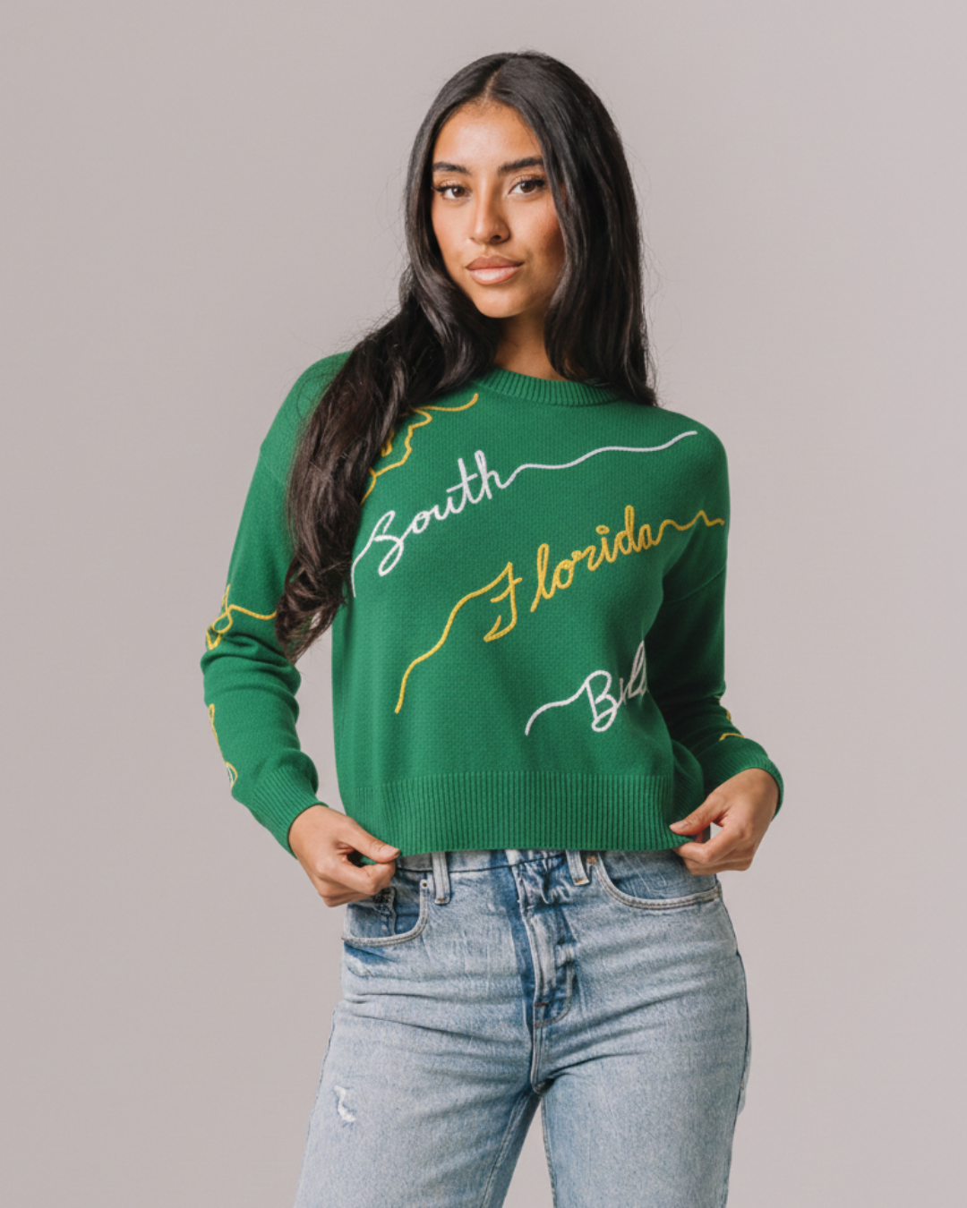 Green long sleeve love letter sweater with south florida bulls embroidery, perfect for game day.