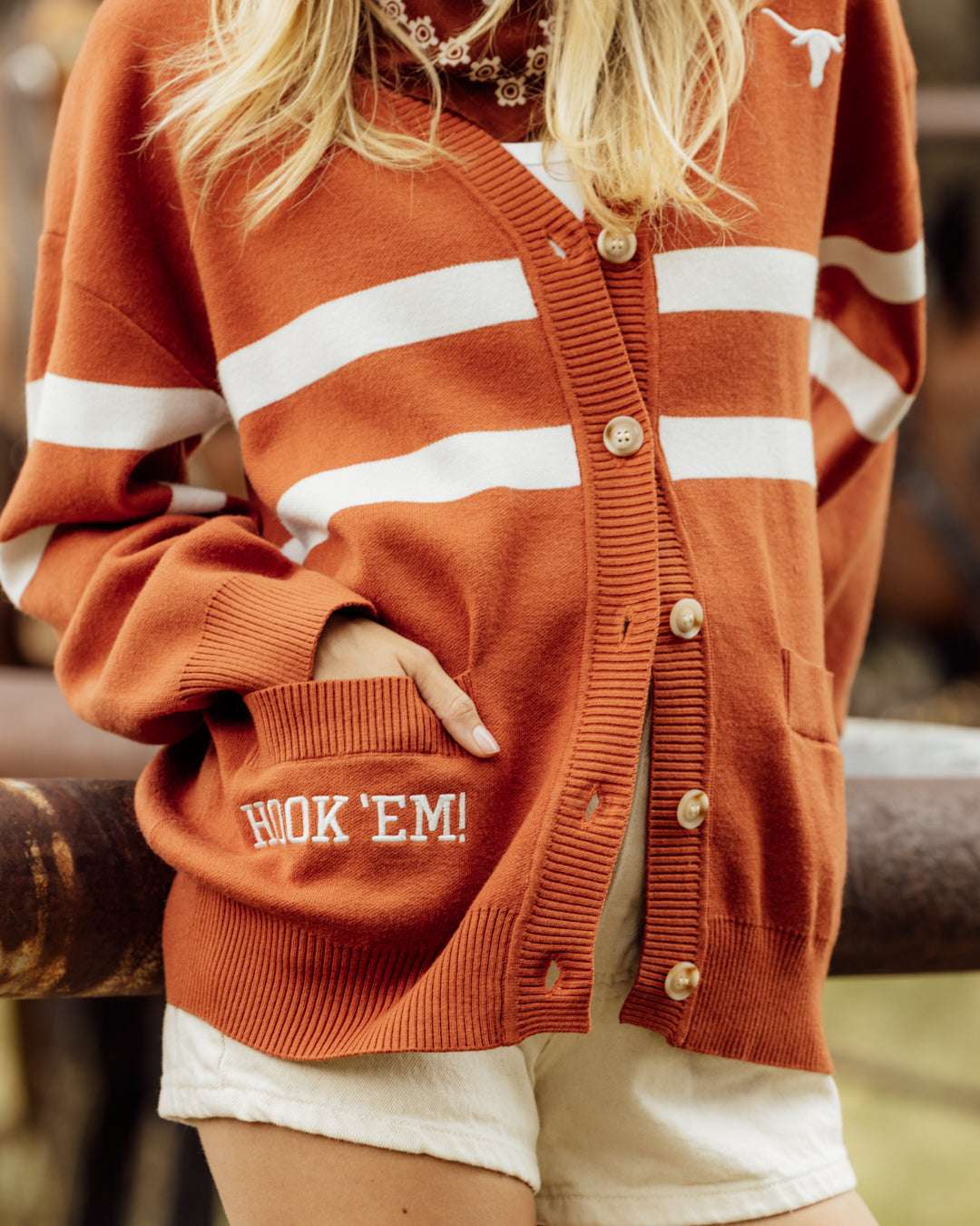 Burnt orange button up cardigan with texas longhorns embroidery, styled for tailgates, campus, and game days.